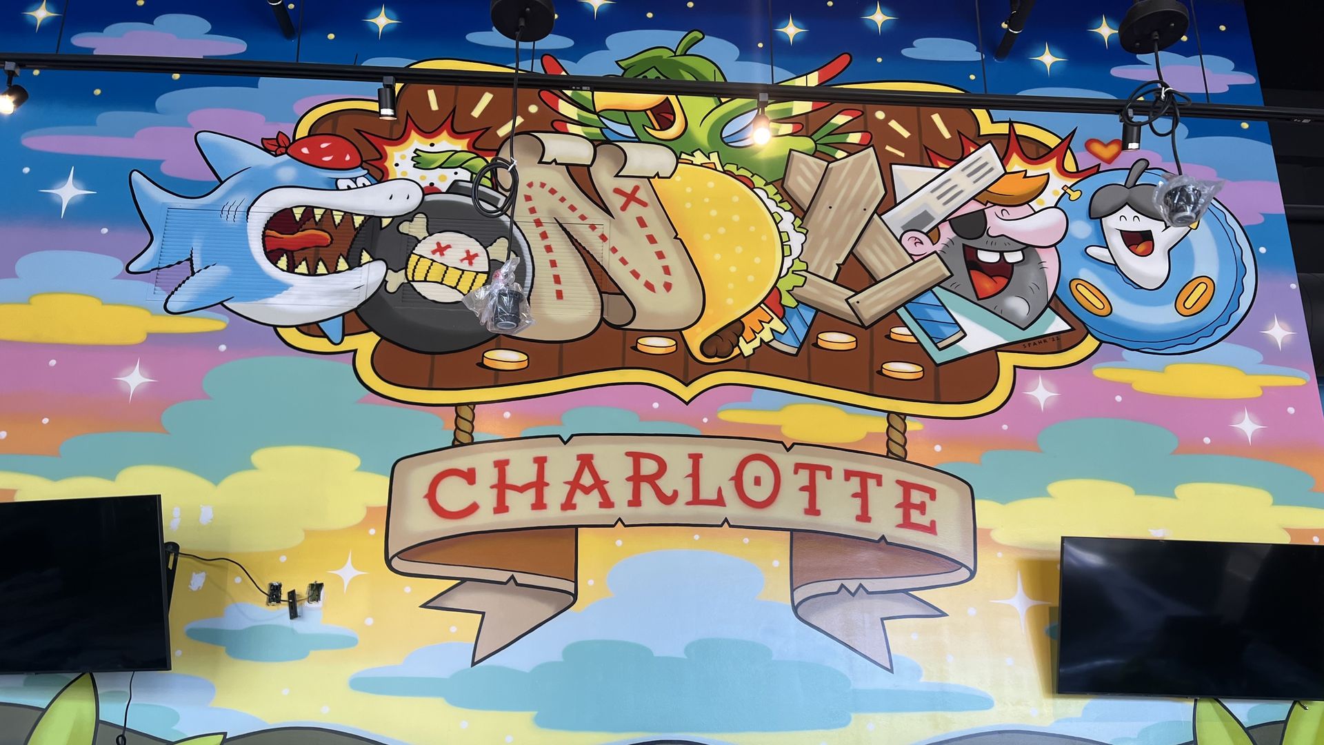 Mural that says Condos and Charlotte