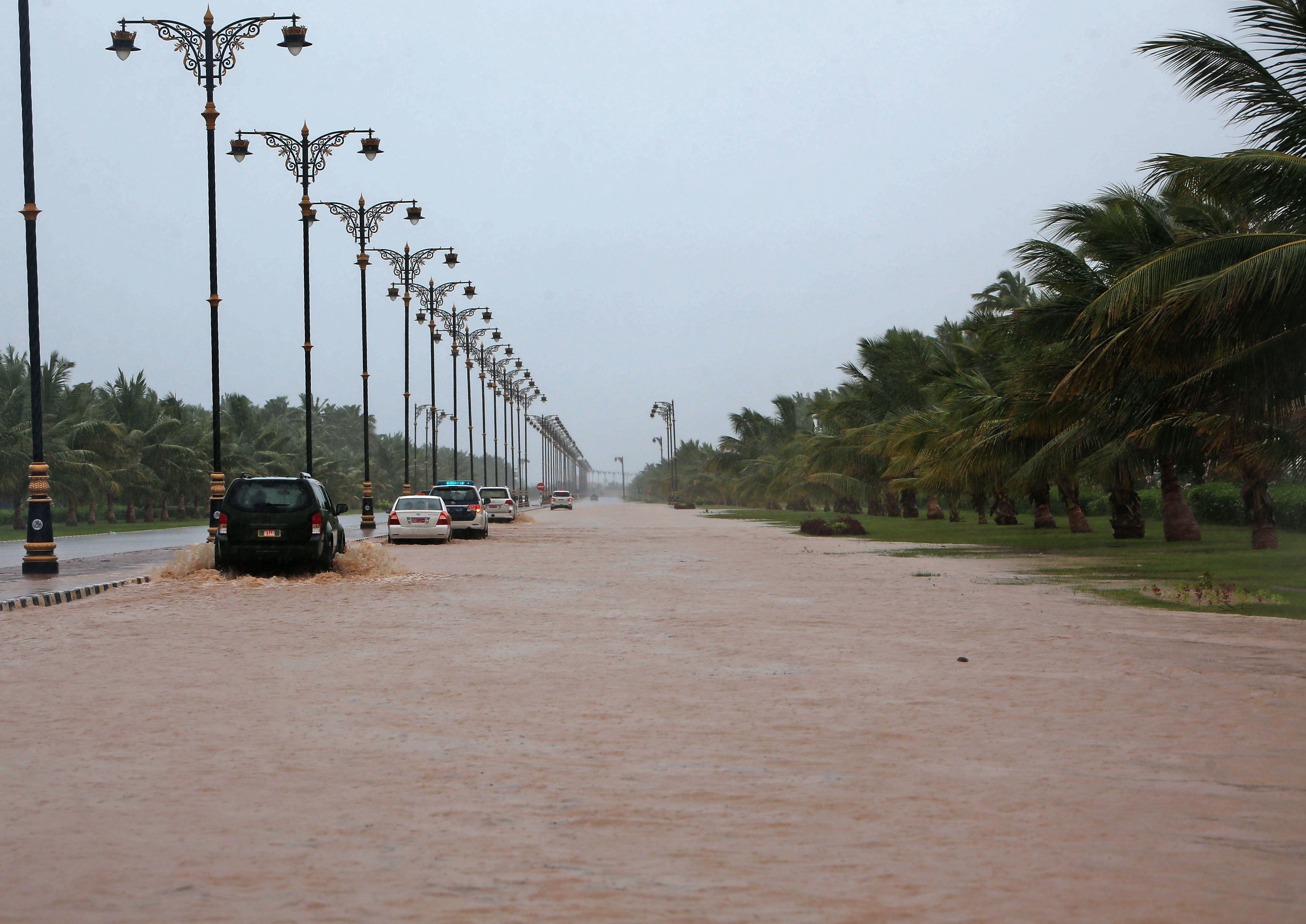 Cars in a flooded street in Oman.