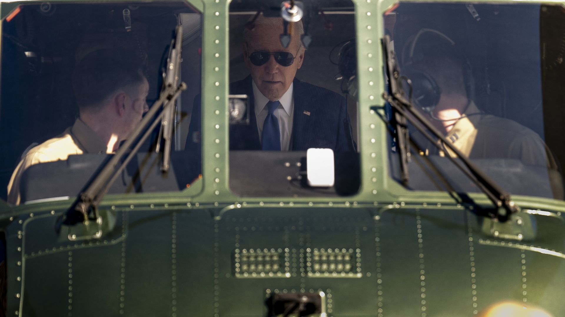 President Joe Biden speaks to pilots aboard Marine One as he arrives at the Wall Street Landing Zone in New York, Wednesday, Feb. 7, 2024, to attend fundraisers