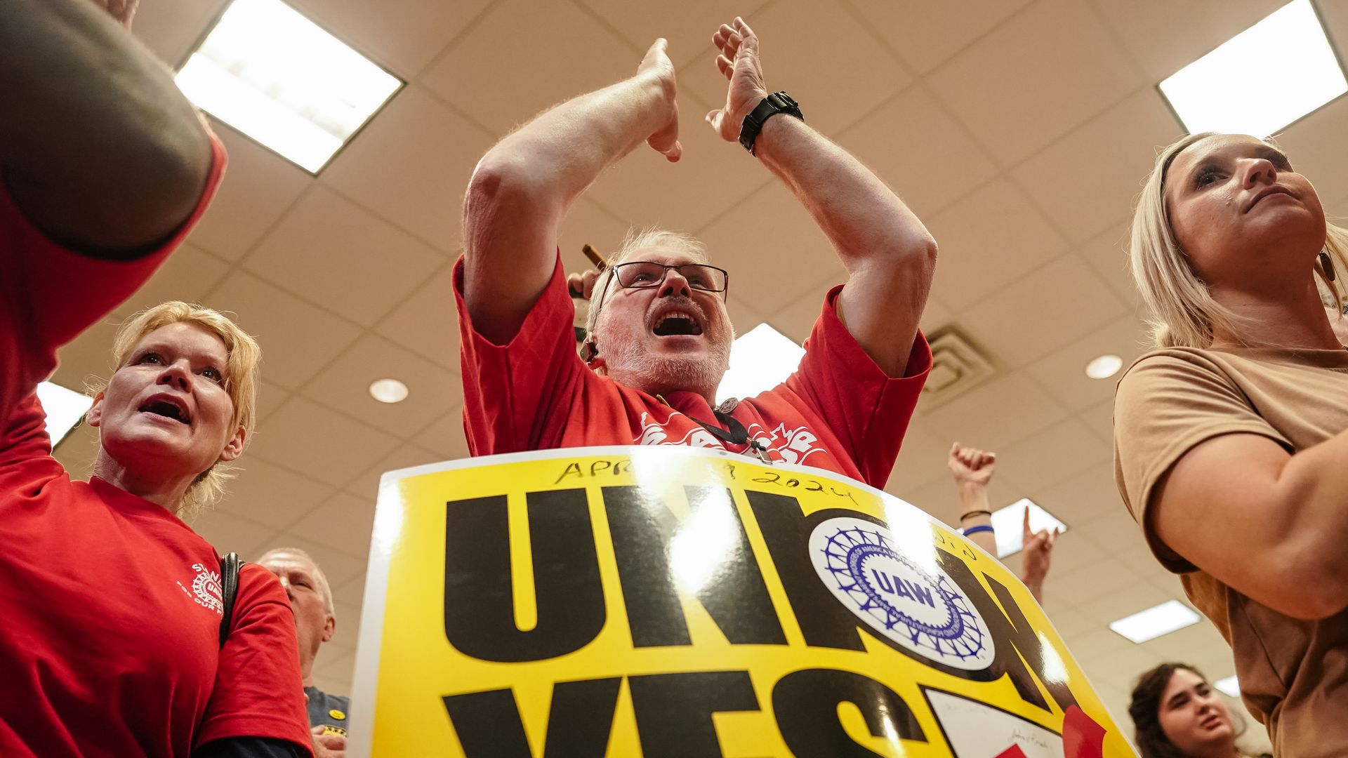  People celebrate at a United Auto Workers vote watch party on April 19, 2024 in Chattanooga, Tennessee. 
