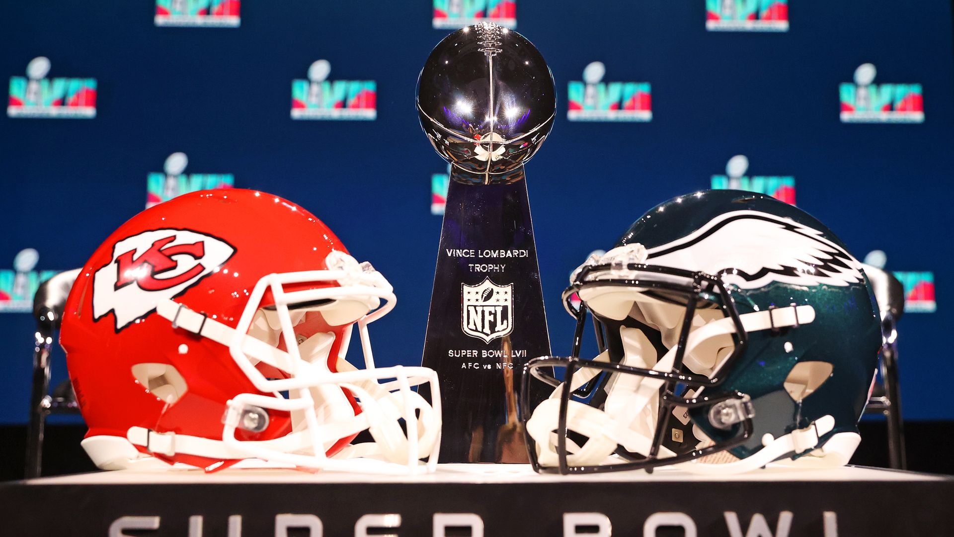 Two helmets sit facing each other