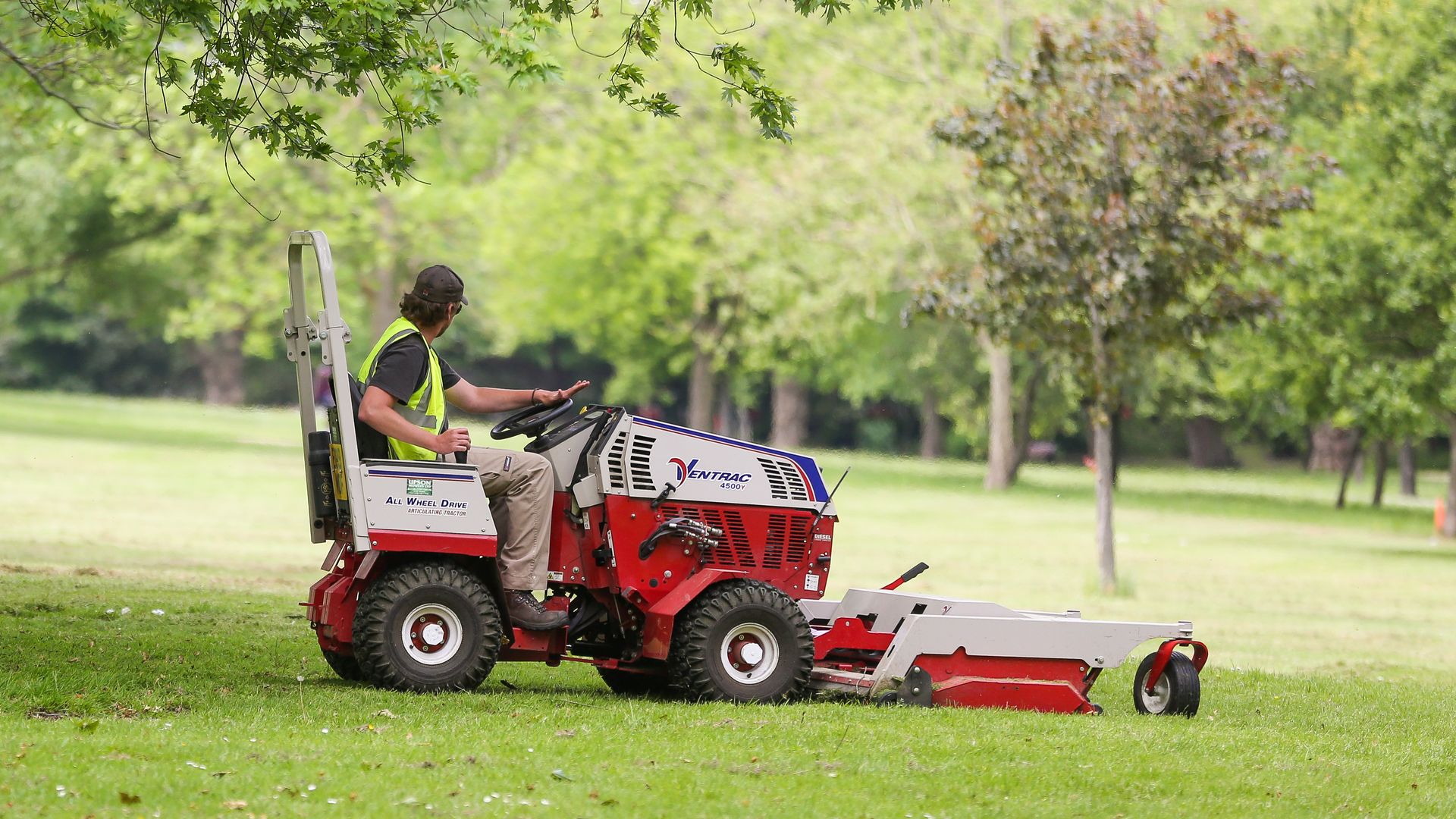 A man on a riding mower.