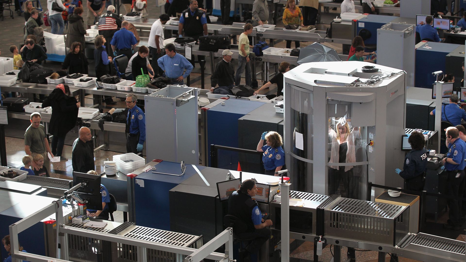 Travelers making their way through the Transportation Security Administration security checkpoint at the Denver International Airport. Photo: John Moore/Getty Images