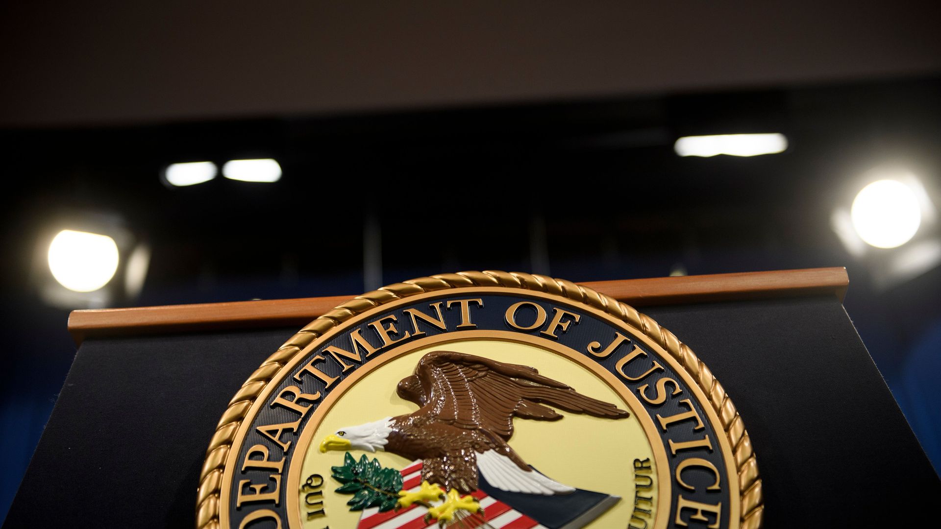 The Department of Justice seal on the front of a podium