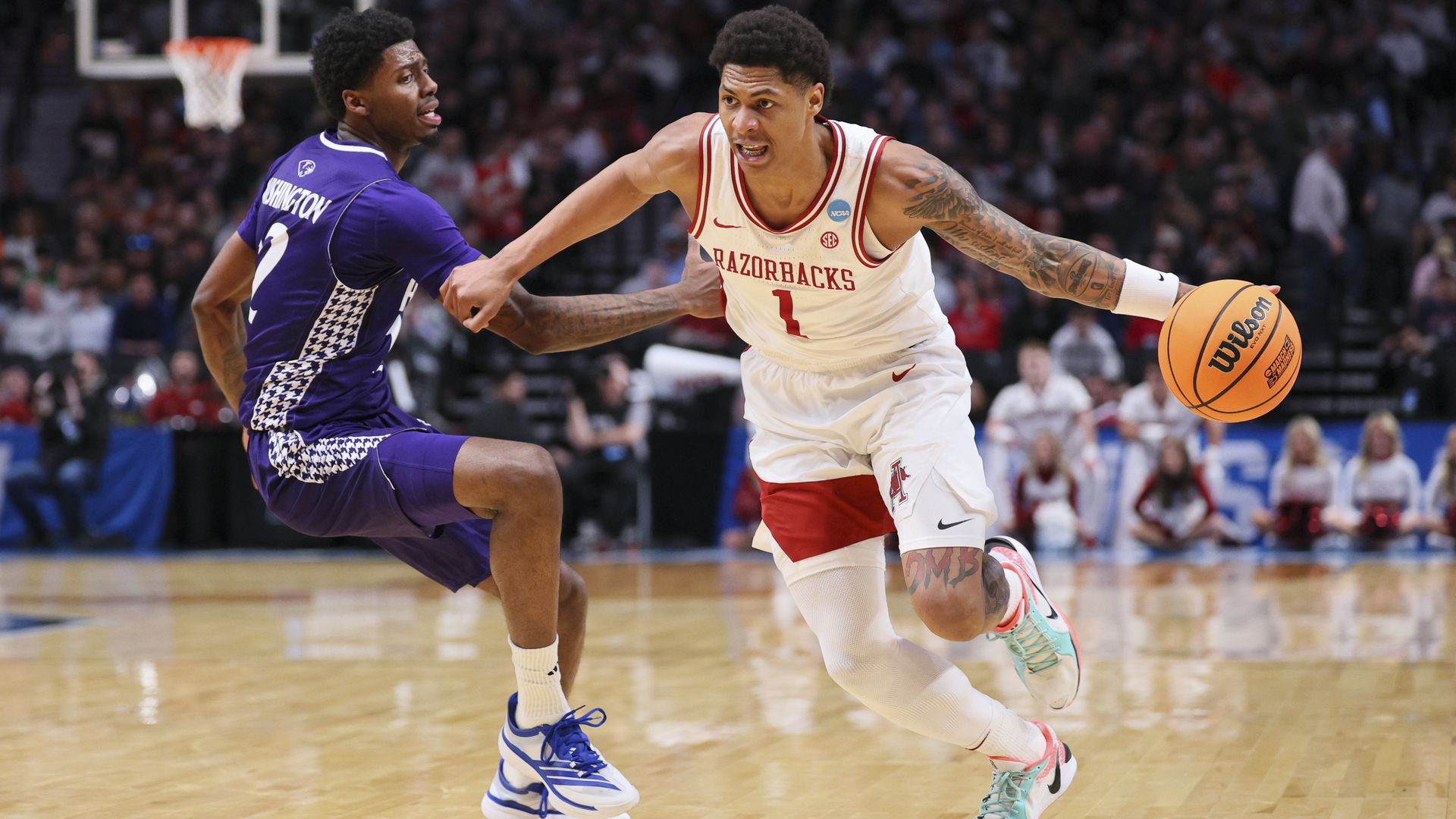 Meleek Thomas #1 of the Arkansas Razorbacks goes to the basket against Scotty Washington #12 of the High Point Panthers during the first half of the second round of the 2026 NCAA Men's Basketball Tournament held at Moda Center on March 21, 2026 in Portland, Oregon.