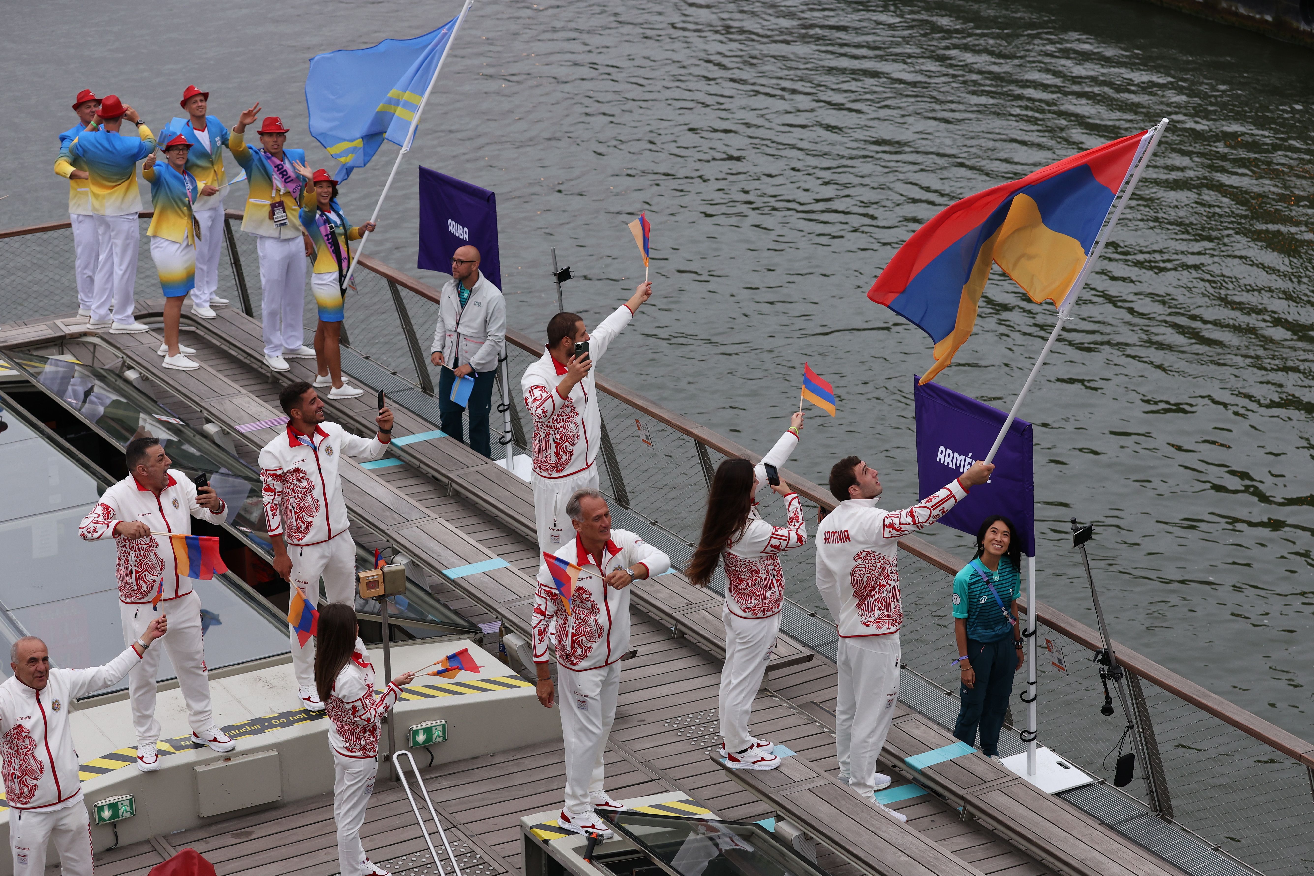Davit Chaloyan, flagbearer of Team Armenia, waves the flag during the opening ceremony of the Olympic Games Paris 2024. Photo: Lars Baron/Getty Images