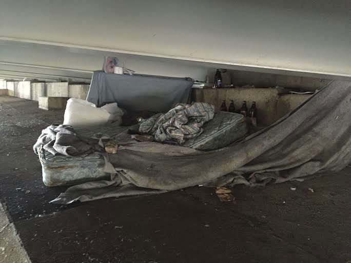 Homeless sleeping under a bridge