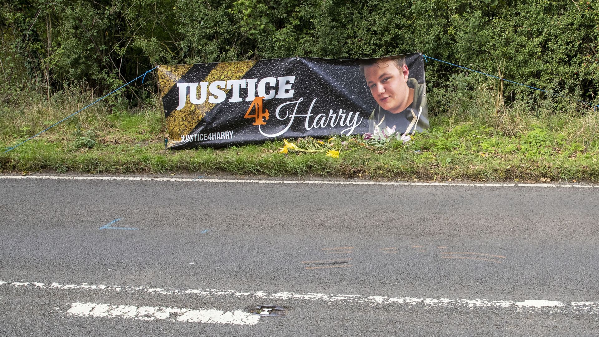 Floral tributes on the B4031 outside RAF Croughton, in Northamptonshire, where Harry Dunn, 19, died when his motorbike was involved in a head-on collision in August.