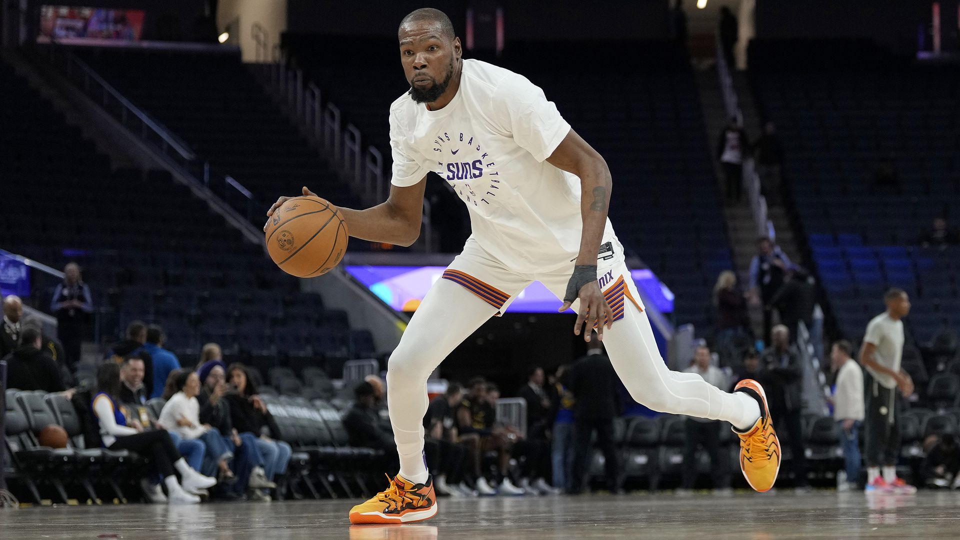 A basketball player warming up. 