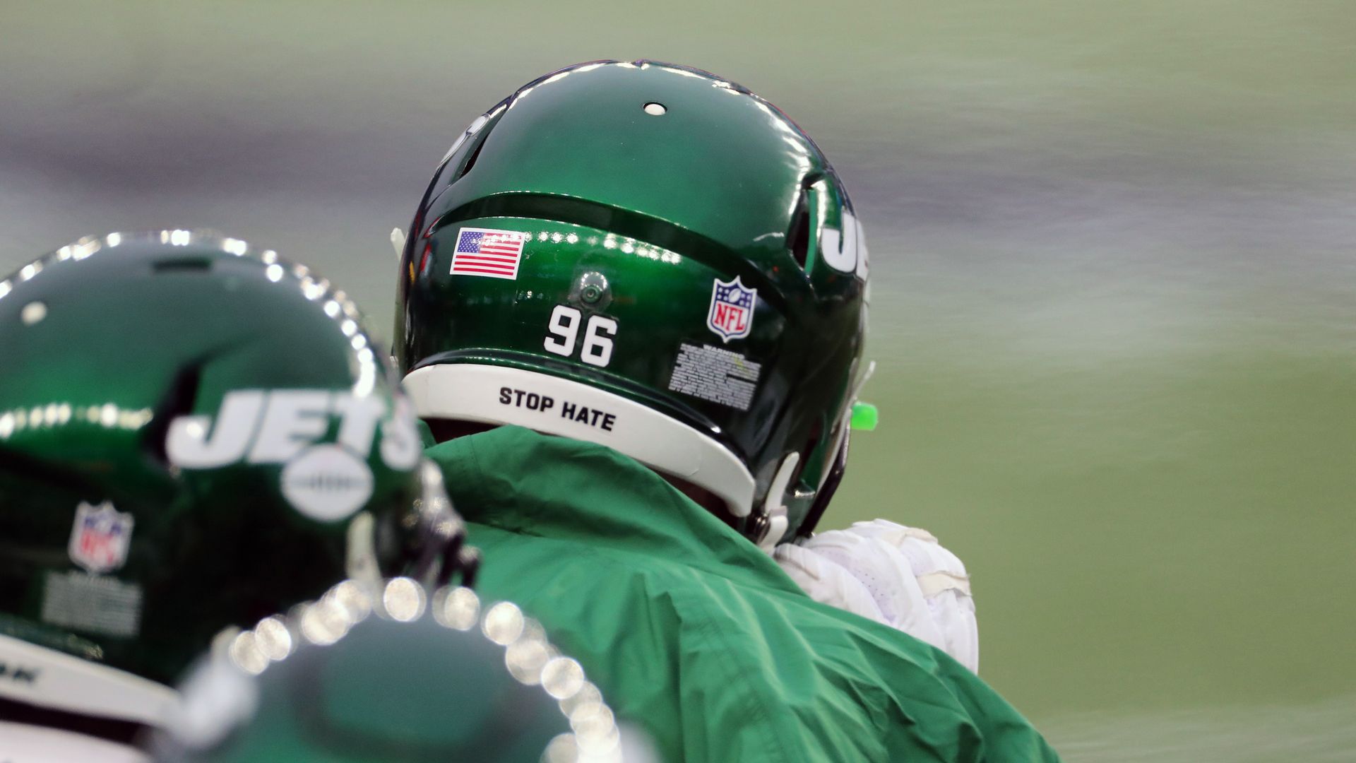 A "Stop Hate" slogan on the back of a New York Jets player's helmet