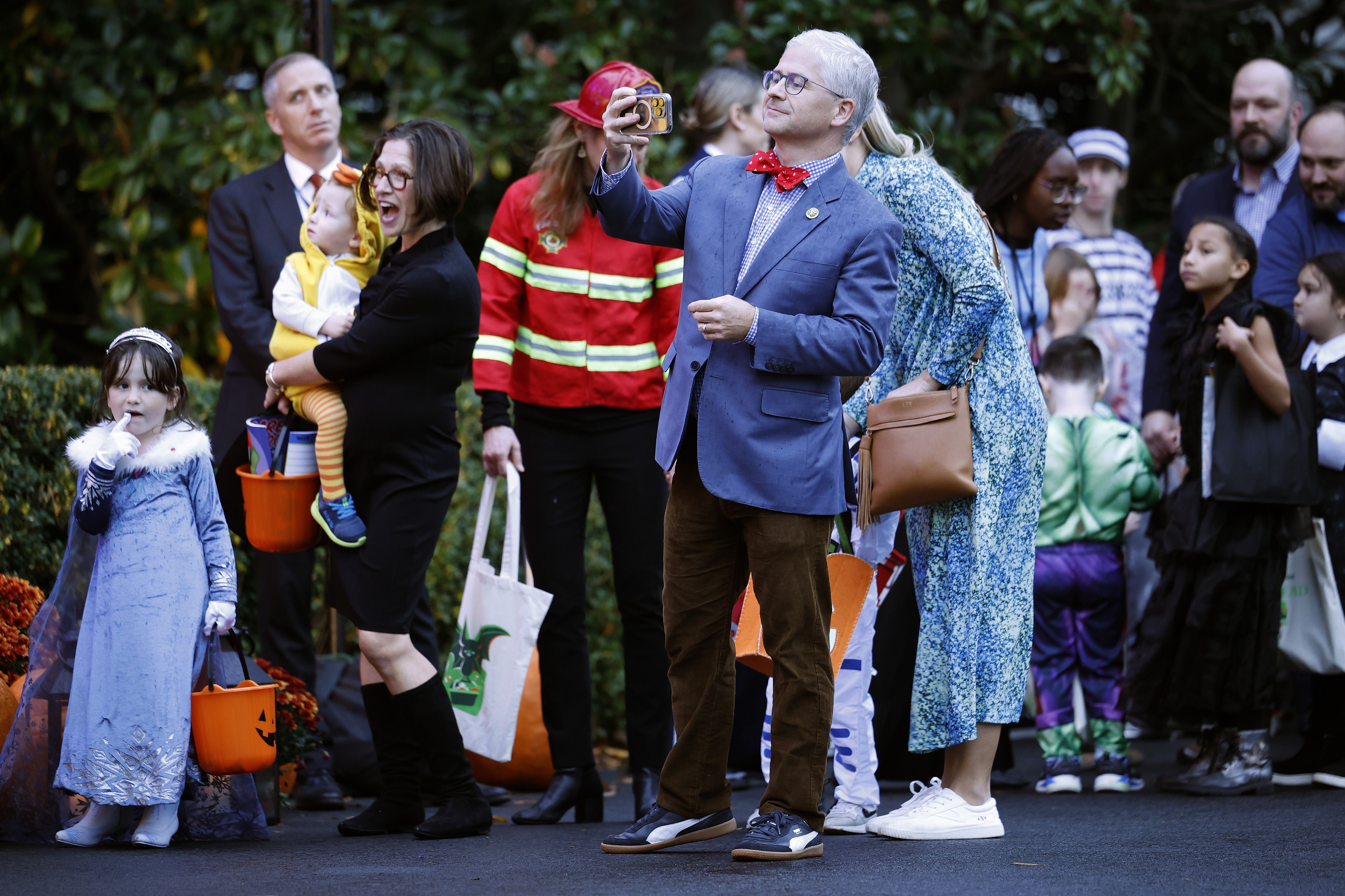 Patrick McHenry takes pictures at White house halloween event