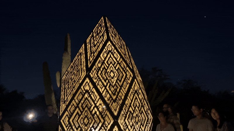 A rotating light-up art piece. 