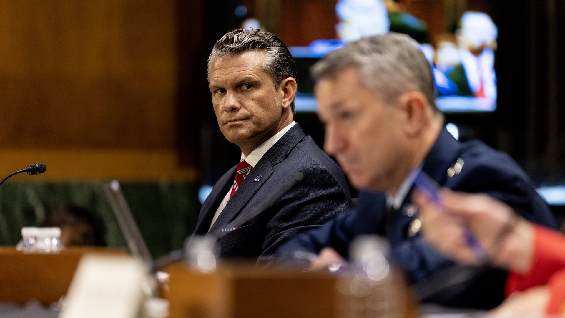 Defense Secretary Pete Hegseth and chairman of the Joint Chiefs of Staff Gen. Dan Caine appear at a Senate hearing this week.