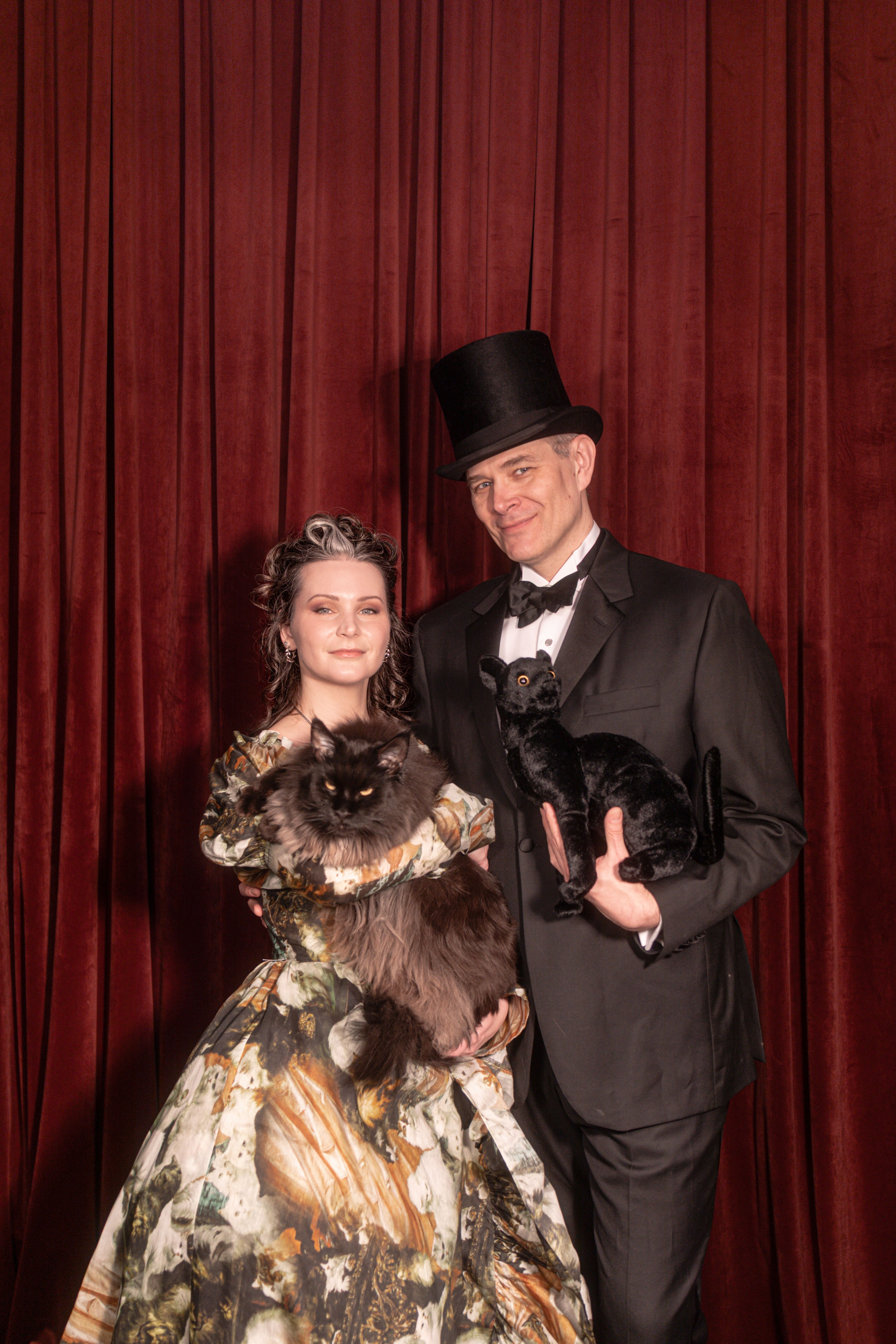Hierophany & Hedge owners Coil and Augur pose with their feline companions, who help run the whimsical Covington magic shop.