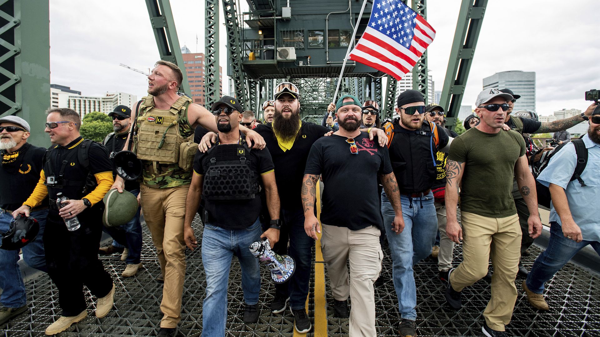 Members of the Proud Boys and other right-wing demonstrators march across the Hawthorne Bridge 