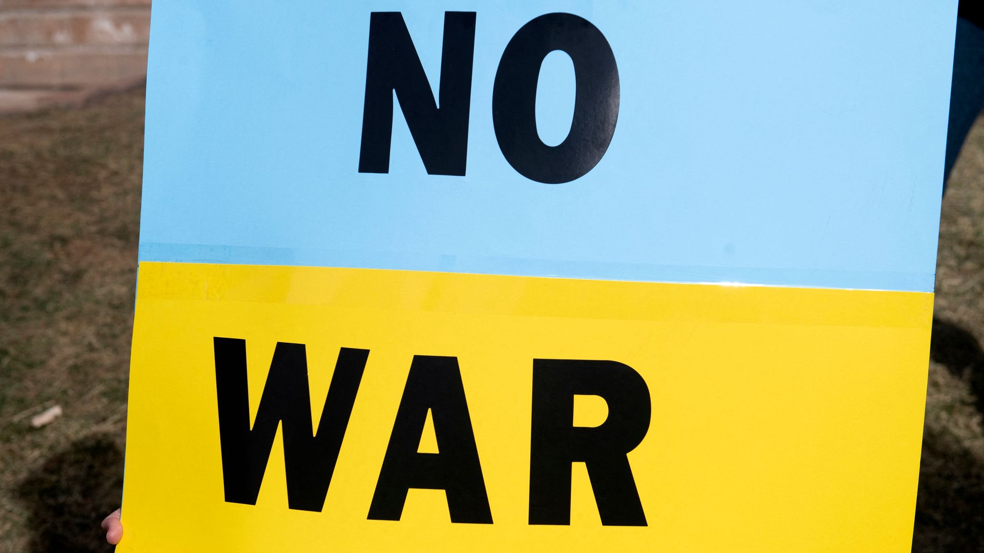 A sign reading "no war"