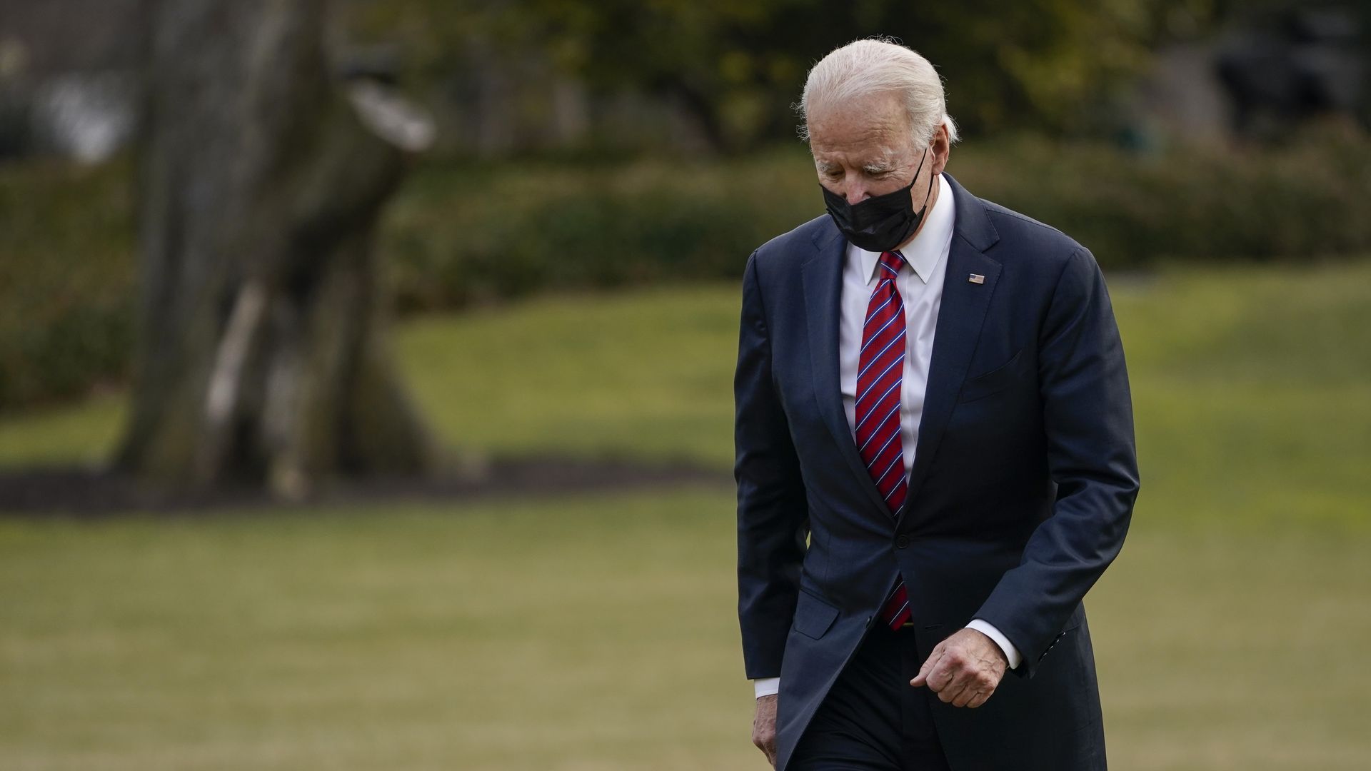 President Biden is seen walking back into the White House after arriving on Marine One.