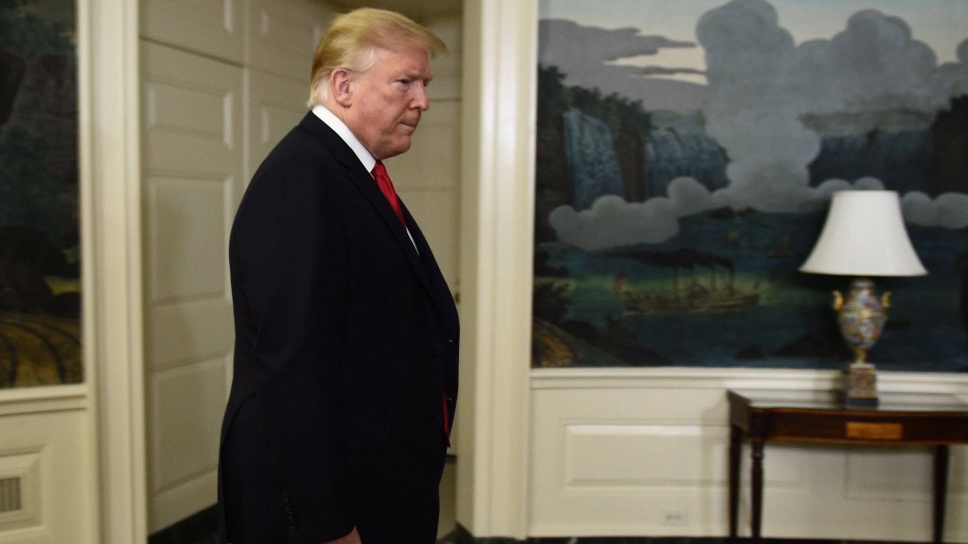 President Trump standing in oval office