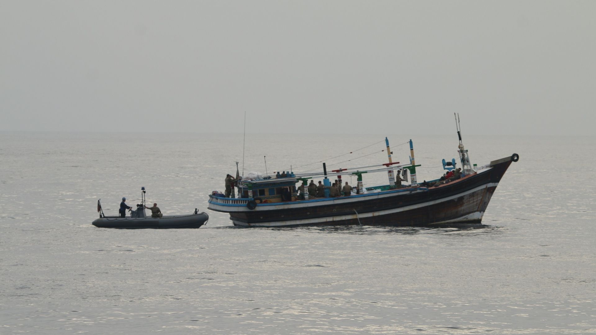 U.S. service members from coastal patrol ship USS Tempest (PC 2) and USS Typhoon confiscate a fishing vessel with drugs. 