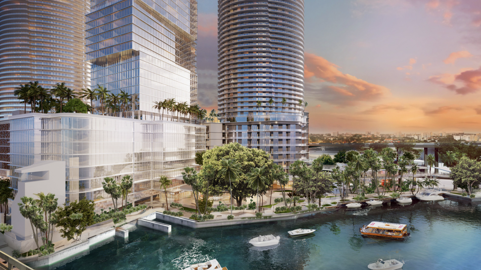 A rendering shows tall, shiny buildings with boats on the river in front.