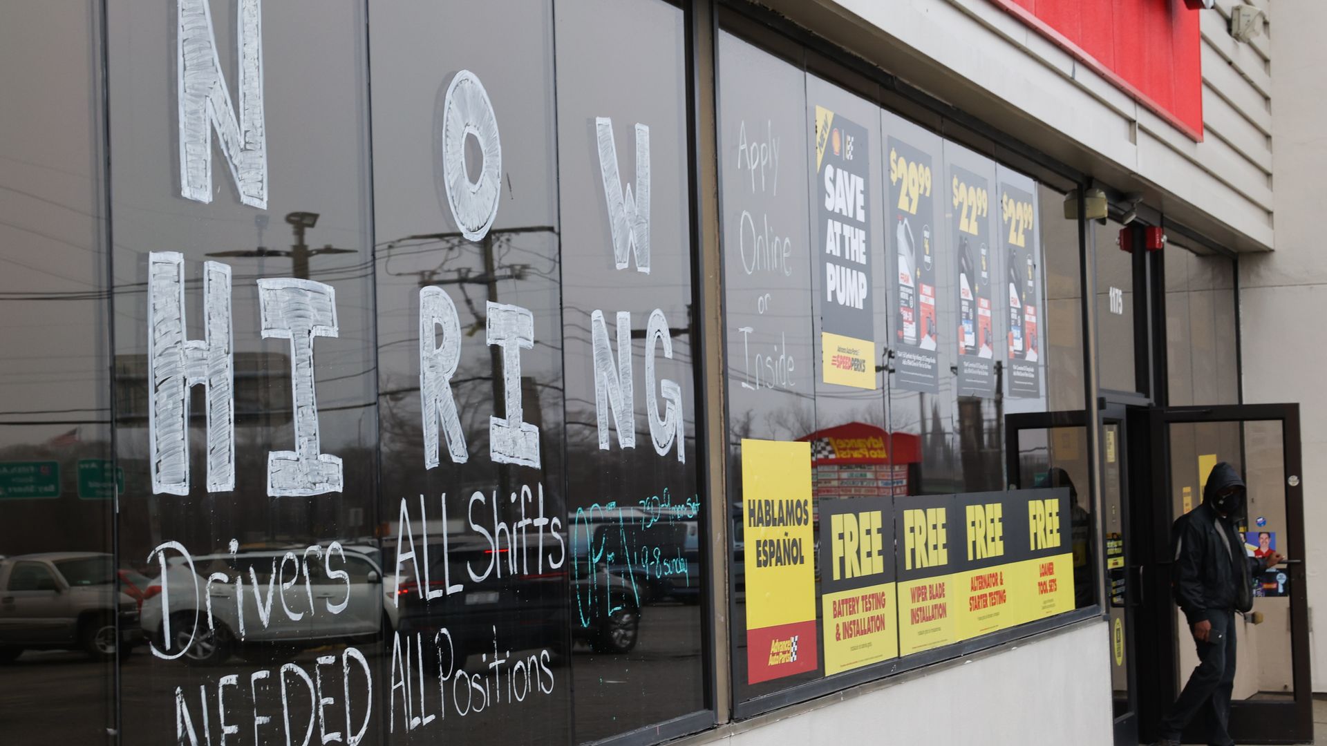 A "Now Hiring" sign on a Long Island store