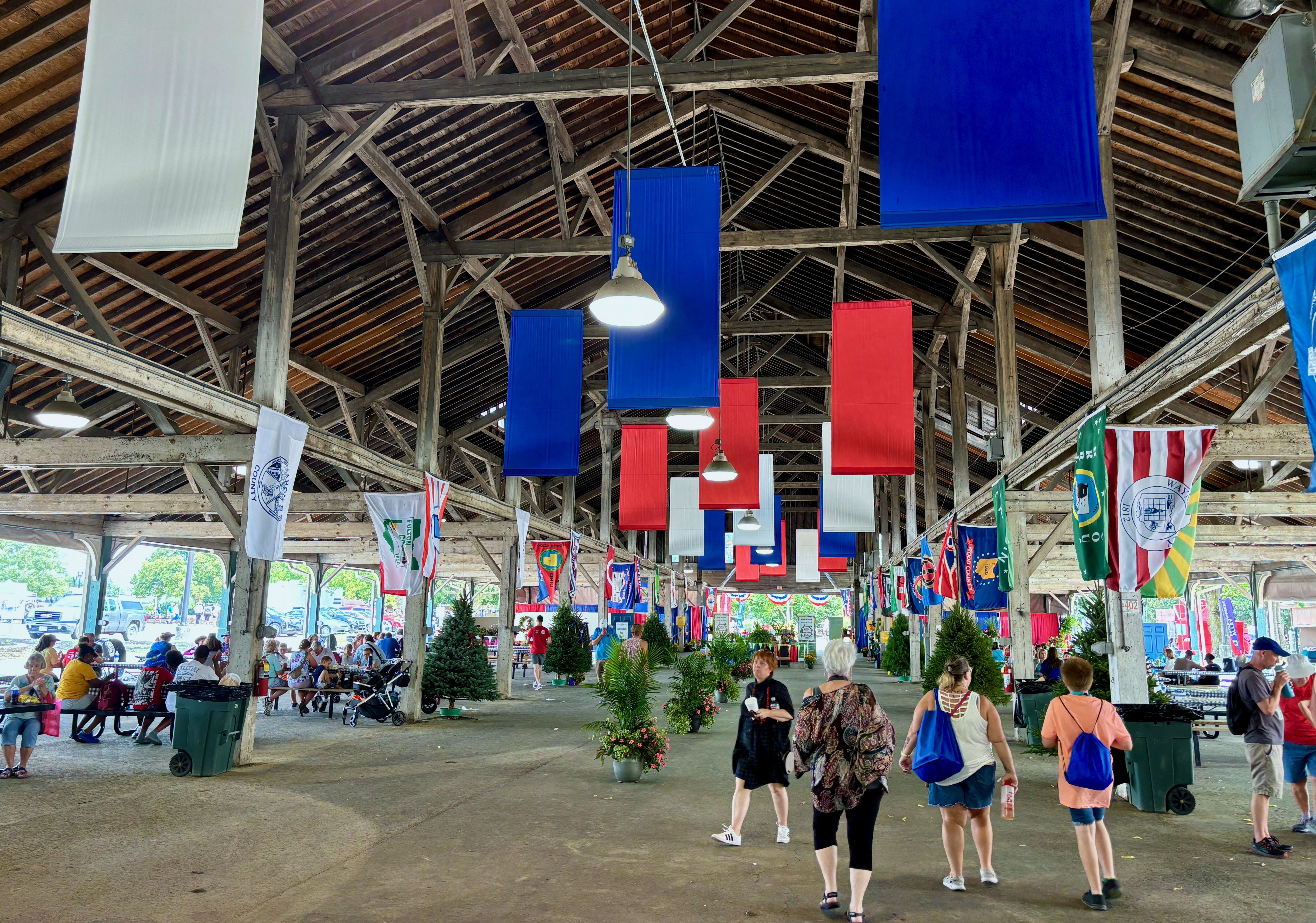A view inside the Taste of Ohio Pavilion, with red, white and blue banners and flags of every Ohio county hanging inside