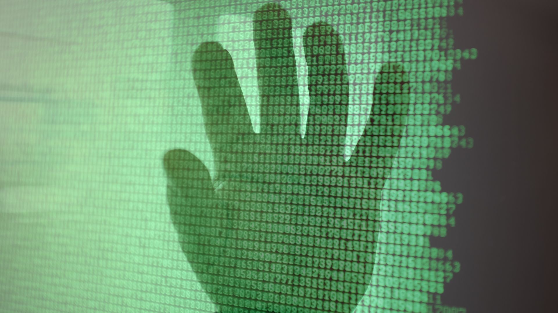 Hand reaches out from data