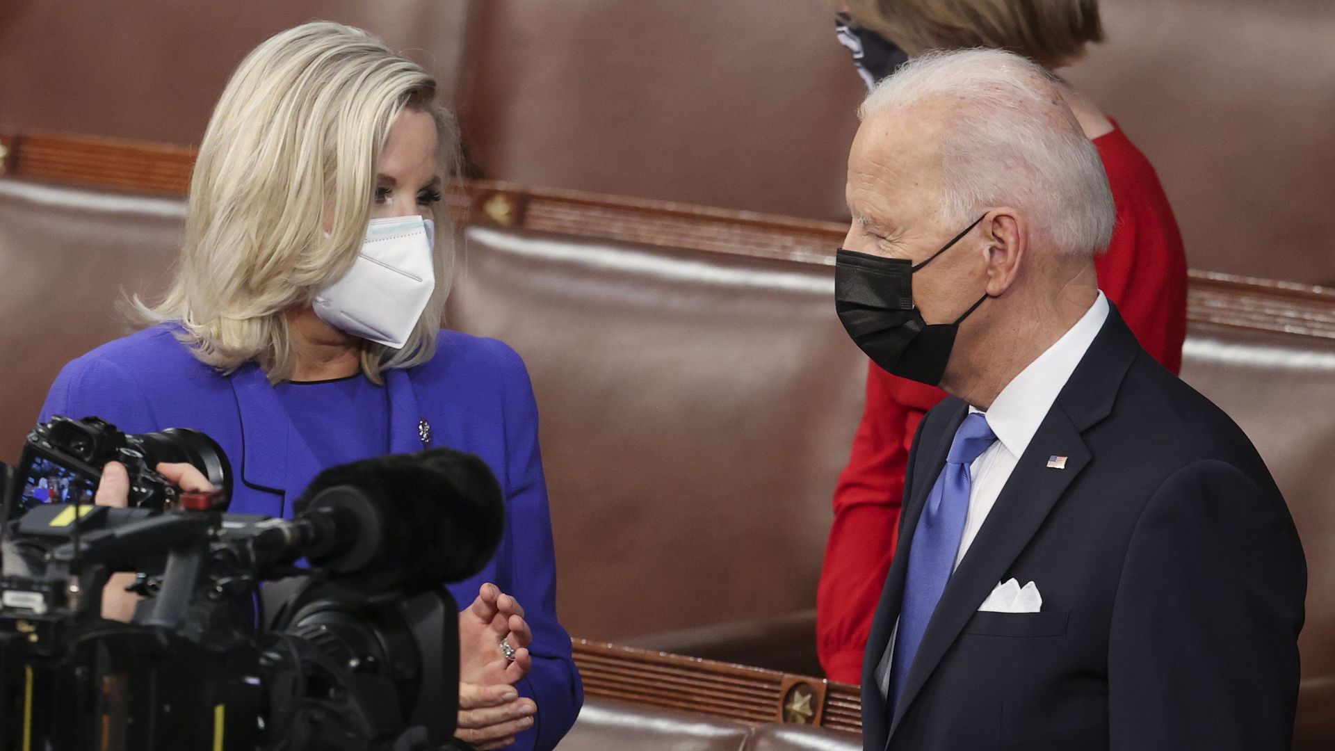 Rep. Liz Cheney speaks to President Biden before his Wednesday speech to a joint session of Congress.