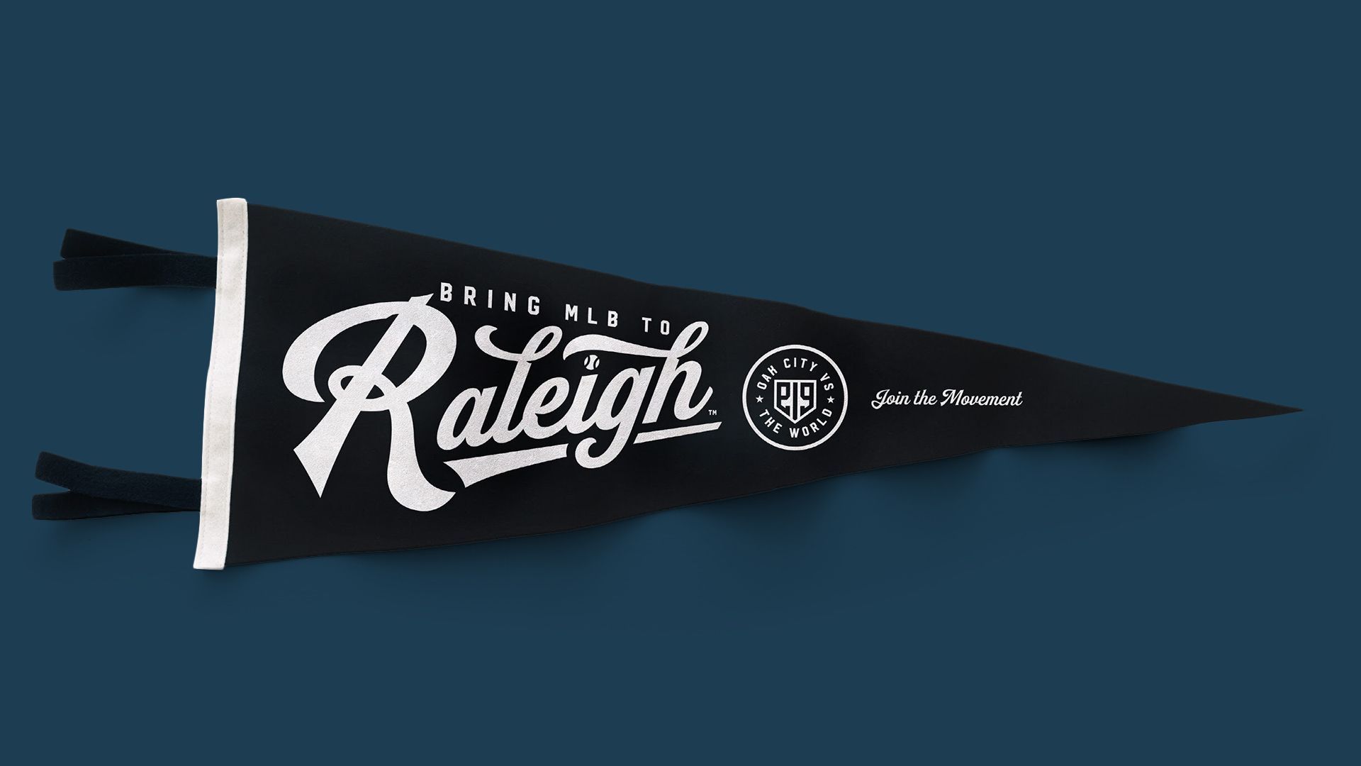 Diagonal black Raleigh pennant with white edge trim on a dark blue background, bold white Raleigh script, small 'BRING MLB TO' text, circular emblem, and 'Join the Movement' on the right.
