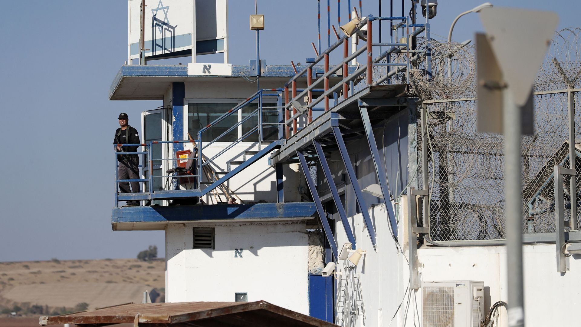  A member of the Israeli security forces stands guard at the Gilboa prison in northern Israel on September 18