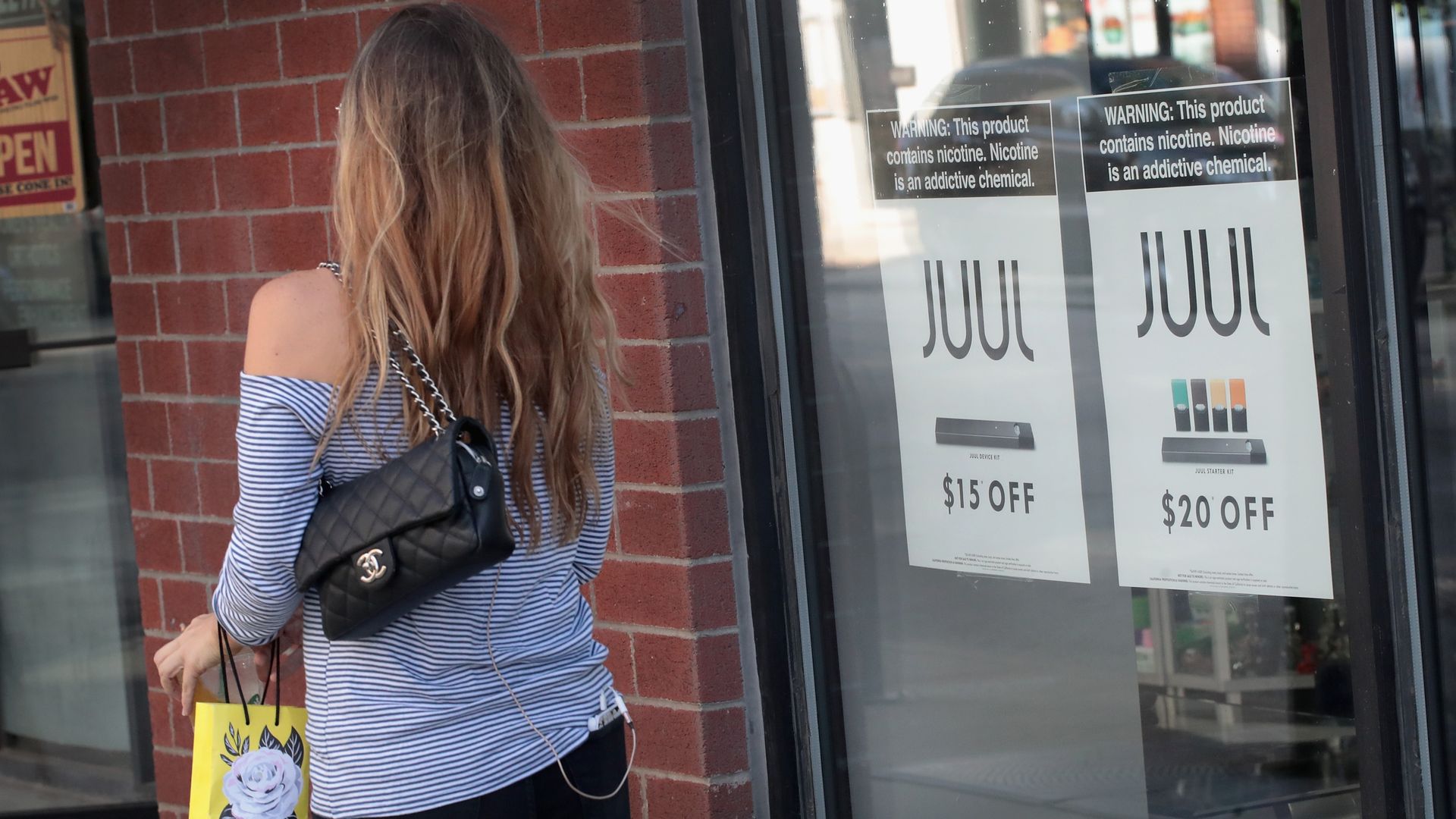 Sings in a window advertise for Juul