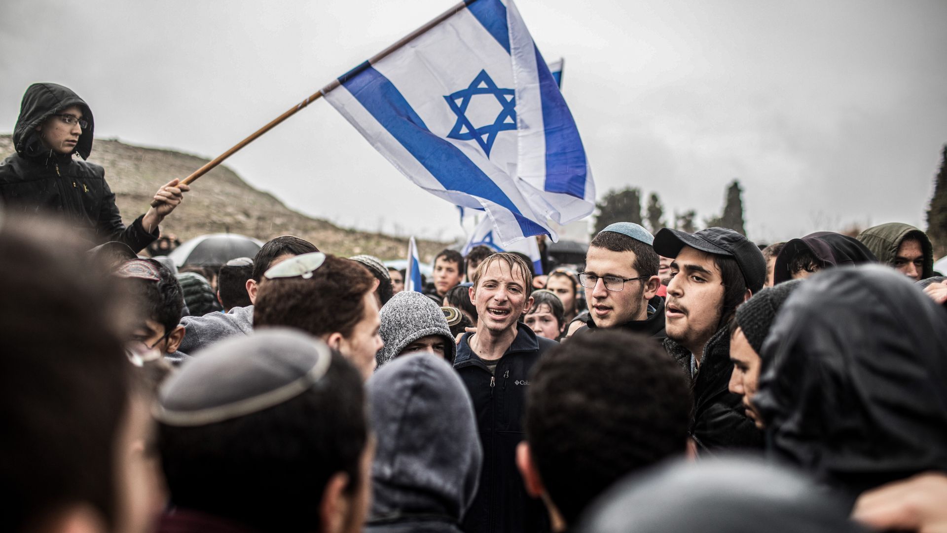Israeli right-wing activists and settlers take part in a protest march at the West Bank outpost of Homesh in Dec. 2021. Photo: Ilia Yefimovich/picture alliance via Getty Images