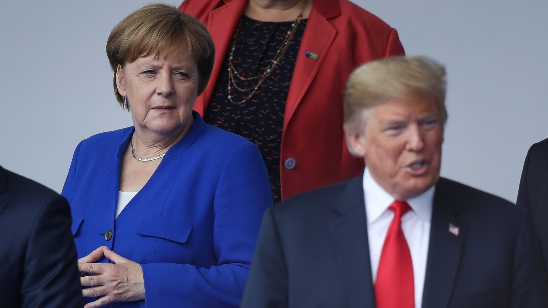 Angela Merkel looking at Donald Trump.