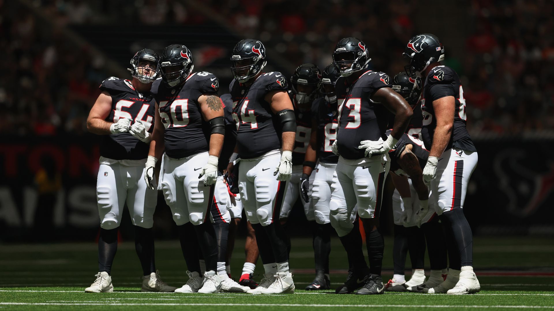 Houston Texans players huddle