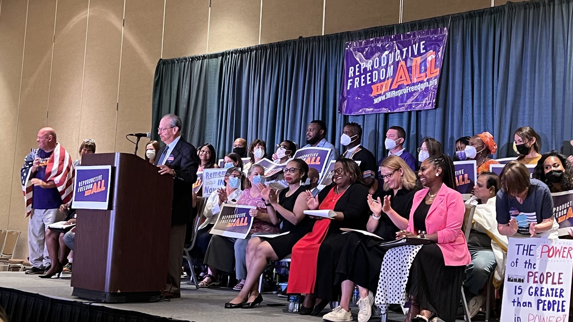 Reproductive Freedom for All organizers and volunteers on stage during a press conference