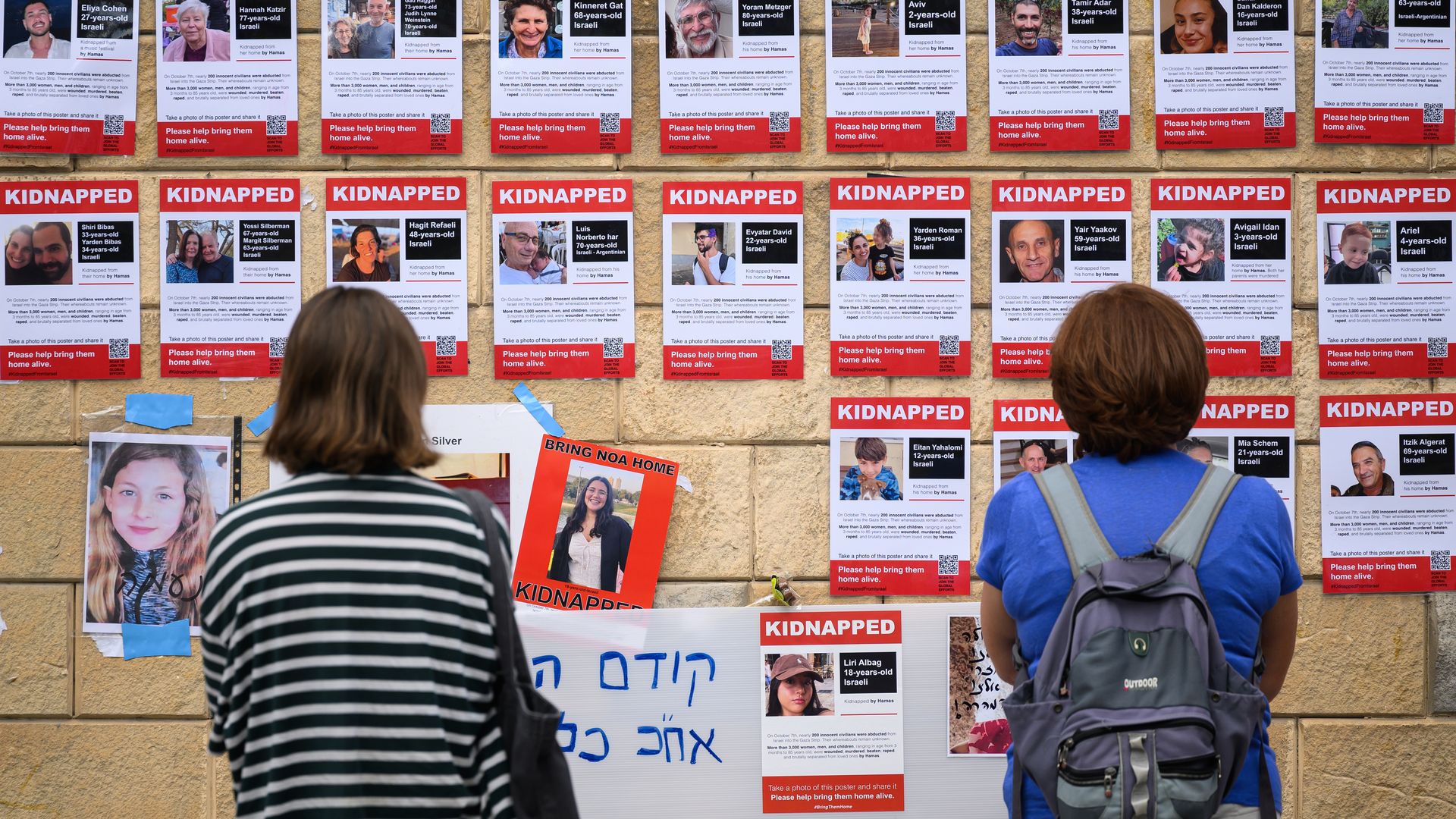 Photographs of some of those taken hostage by Hamas during their recent attacks are seen on October 18, 2023 in Tel Aviv, Israel.