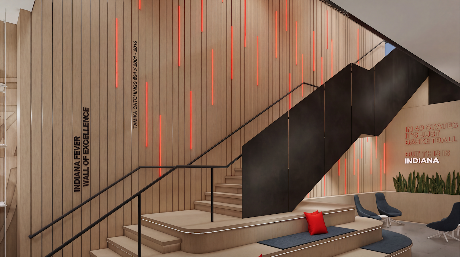 Modern interior with a tall wooden slat wall featuring red vertical light bars, a black diagonal staircase, beige steps, and blue seating with a red cushion; wall text references Indiana basketball.