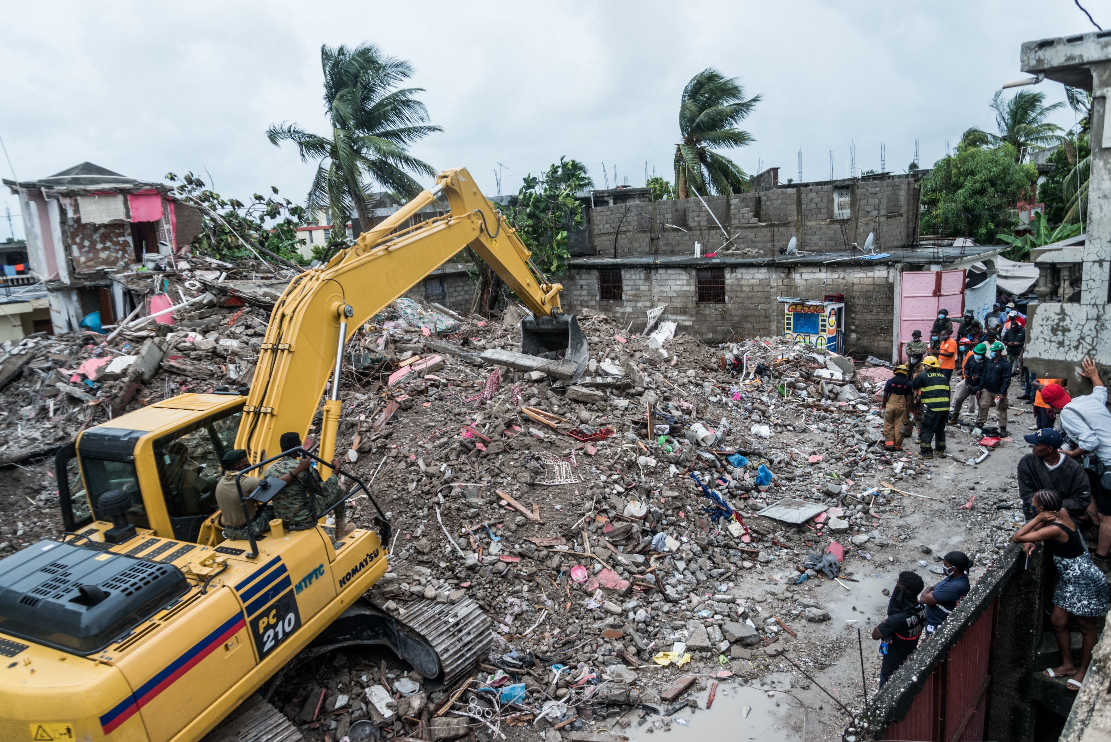  A bulldozer clears the rubble of a building that collapsed in the earthquake in Brefet, Haiti, on Aug. 17.