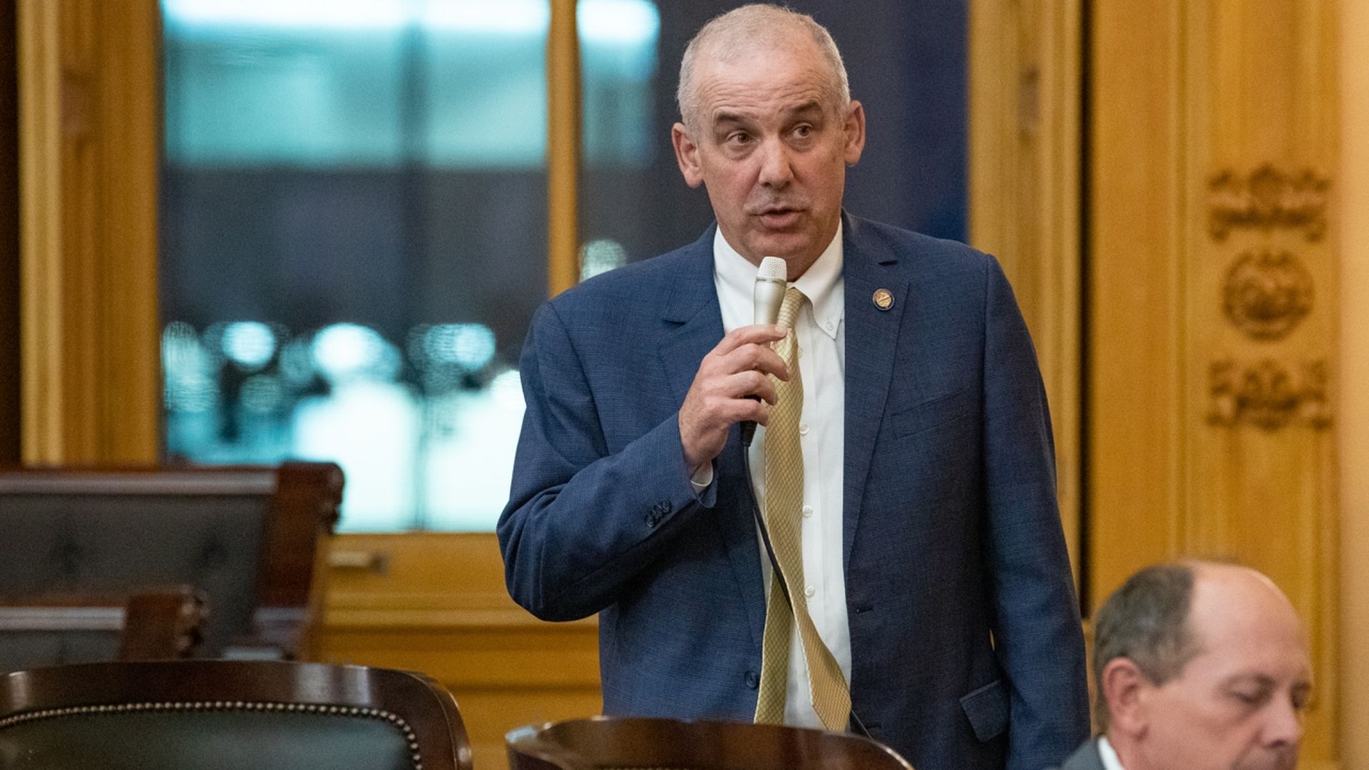Ohio Senate President Matt Huffman speaking into a microphone on the Senate floor.