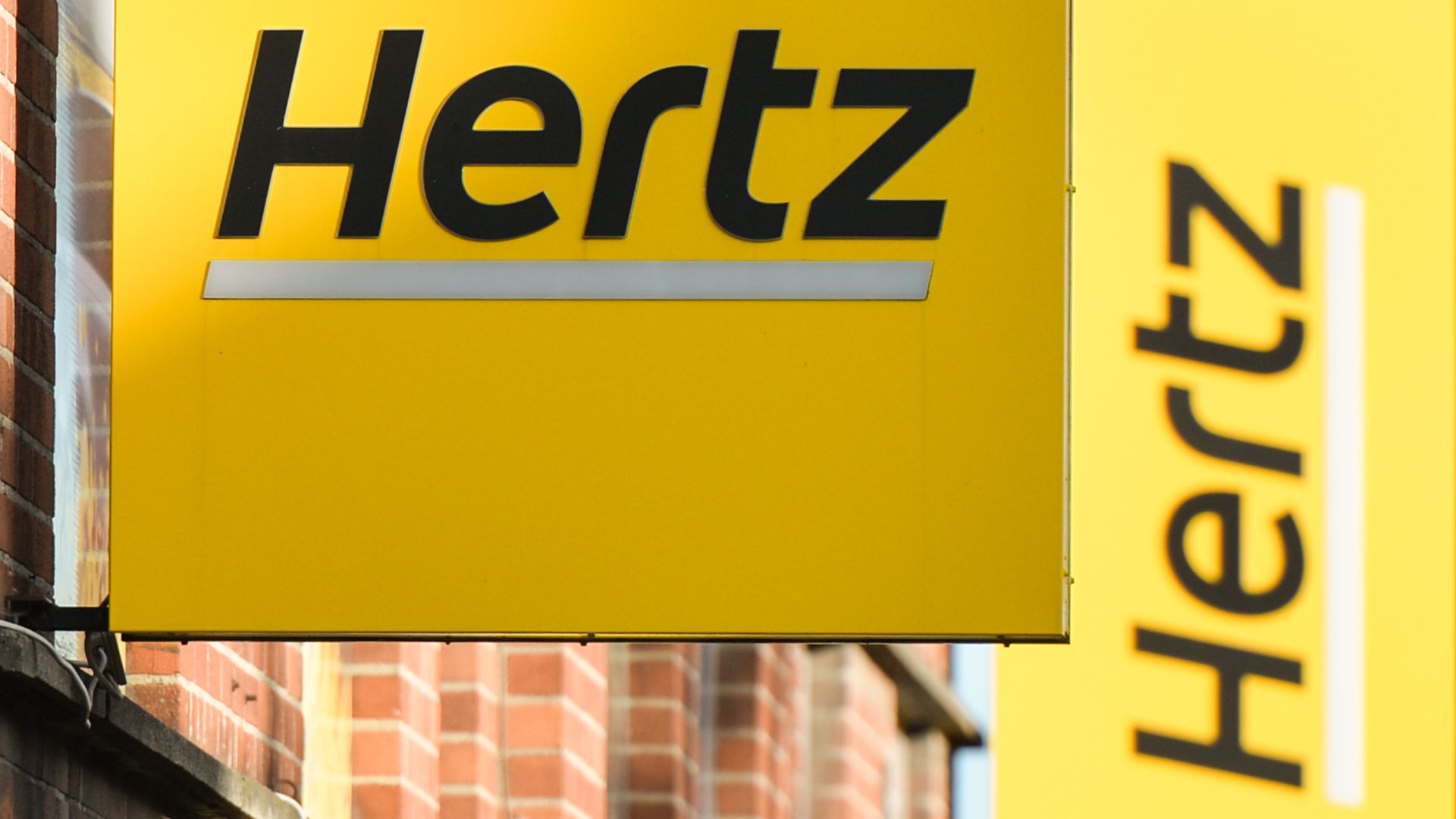 Photo of a Hertz sign outside of one of its locations in Dublin, Ireland.