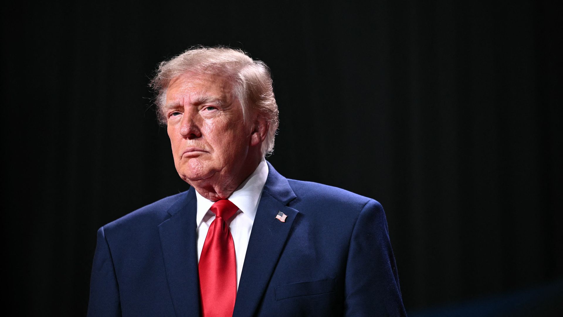 President Trump against a black background.