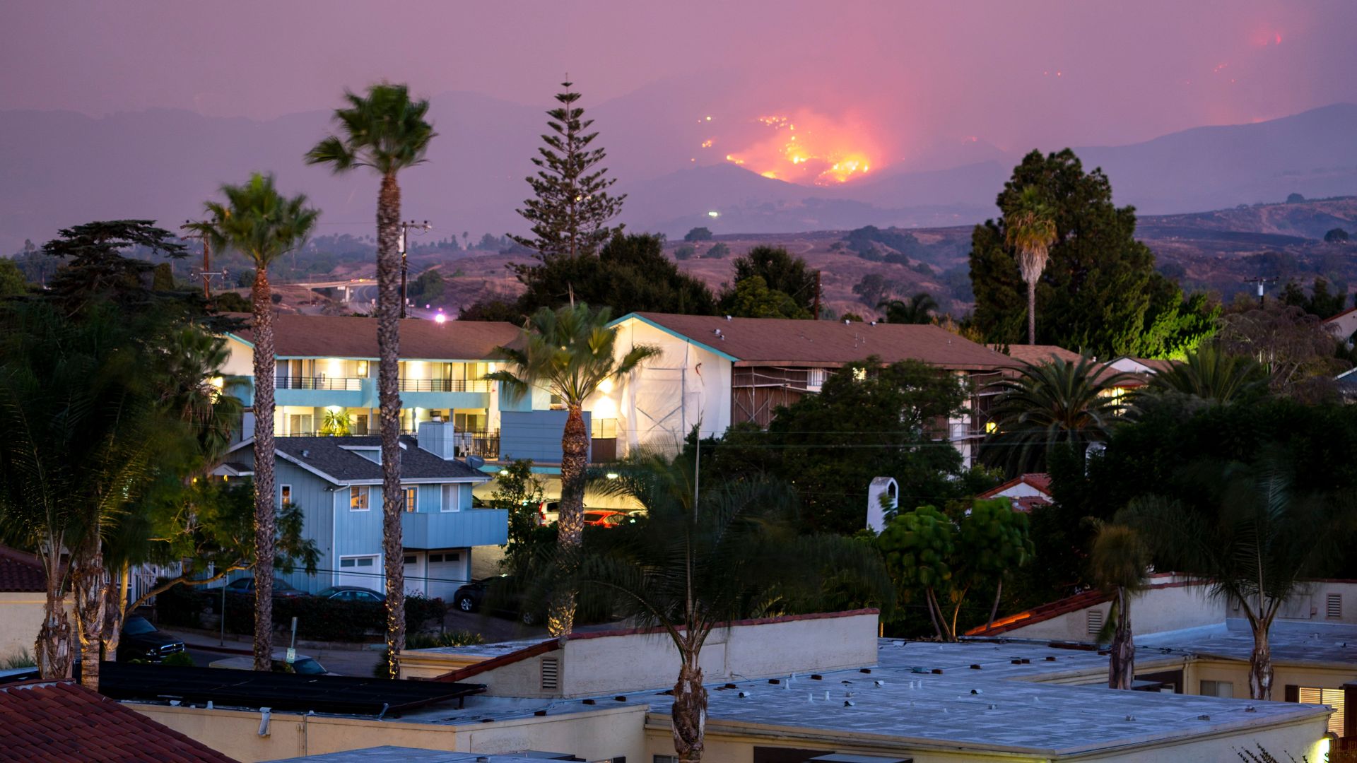 The Cave fire burns a hillside above houses in Santa Barbara