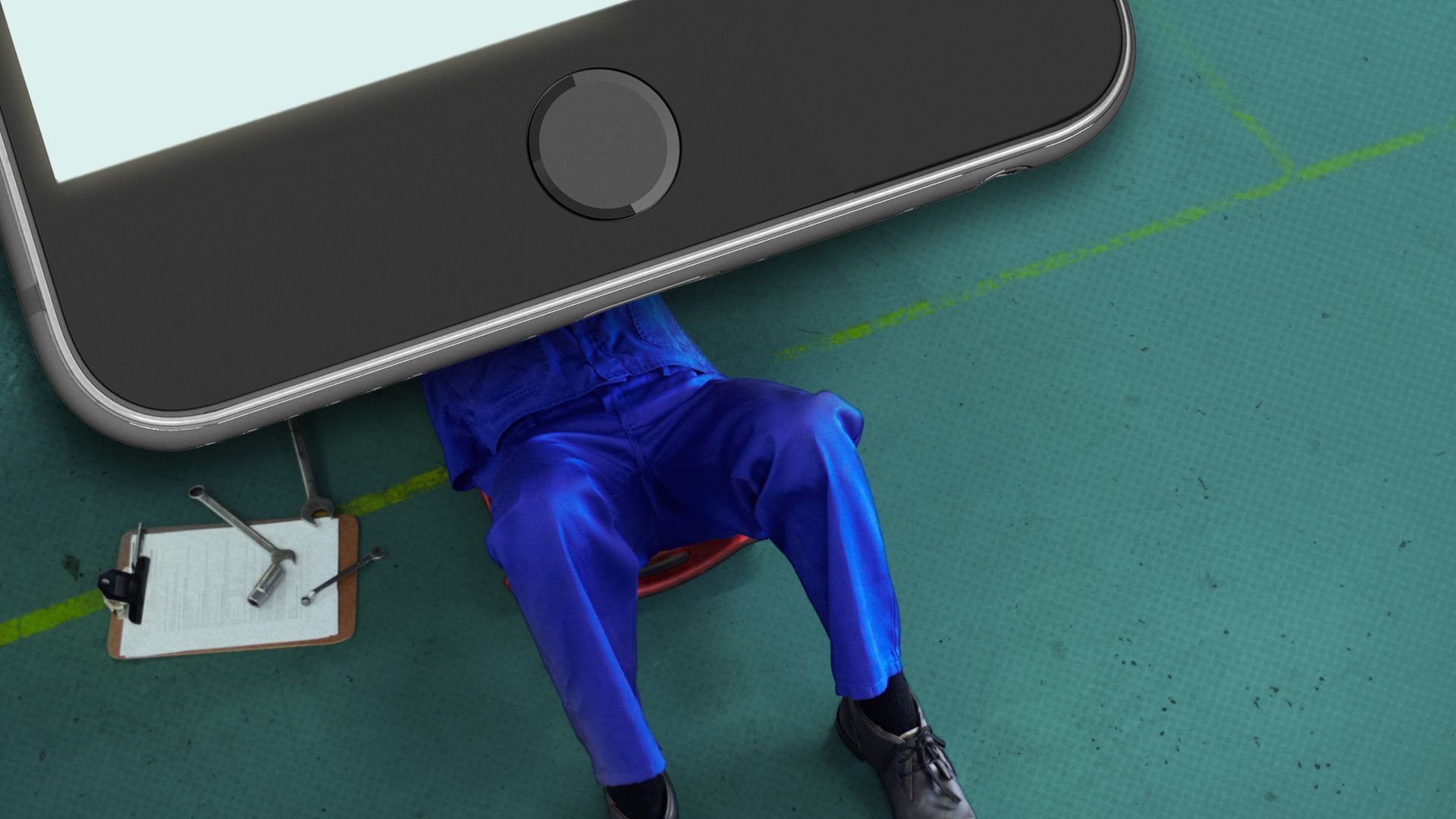 Repairman under a giant iPhone