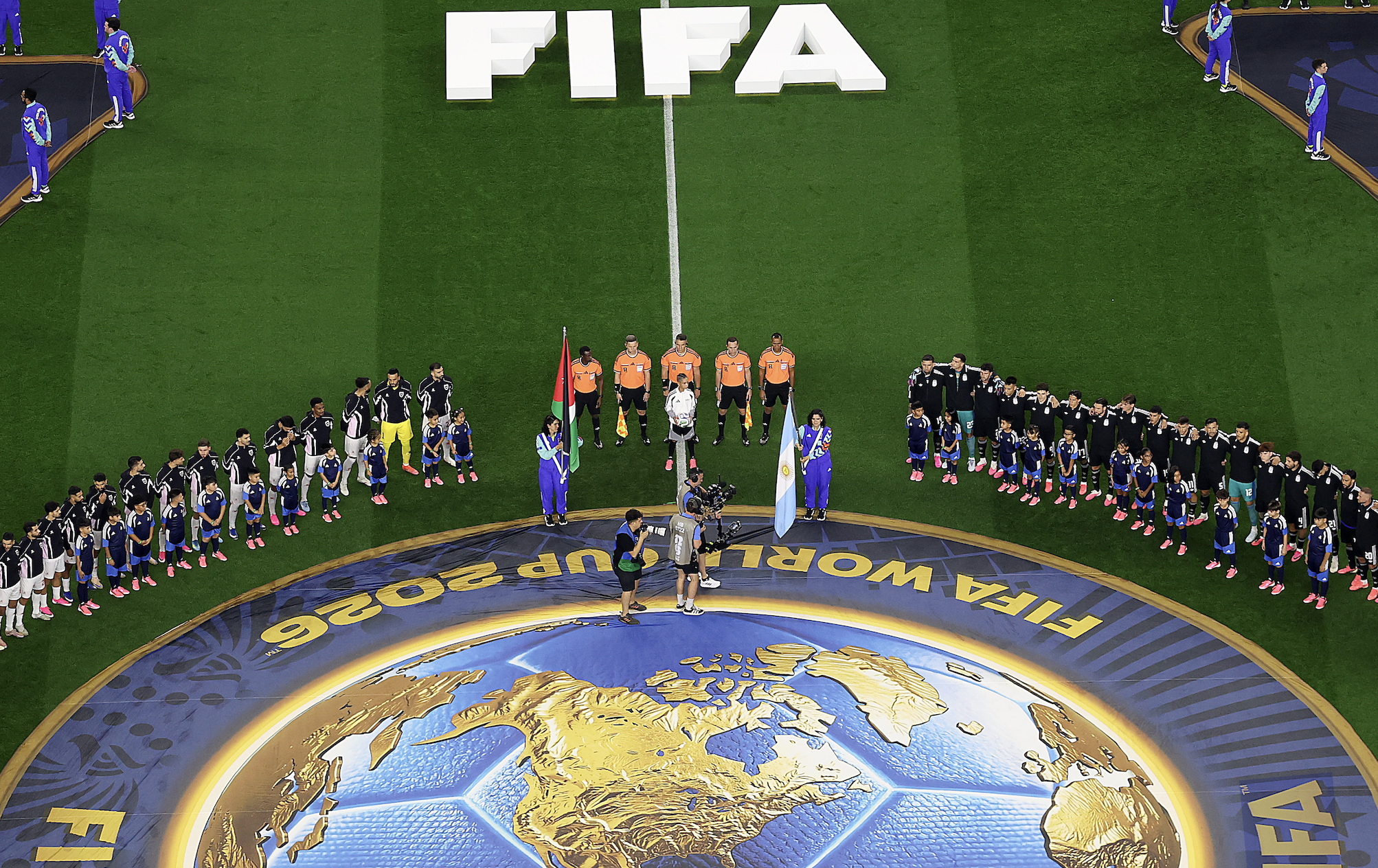 Jordan's and Argentina's players stand on either side of the Villarreal twins before their match on Saturday.