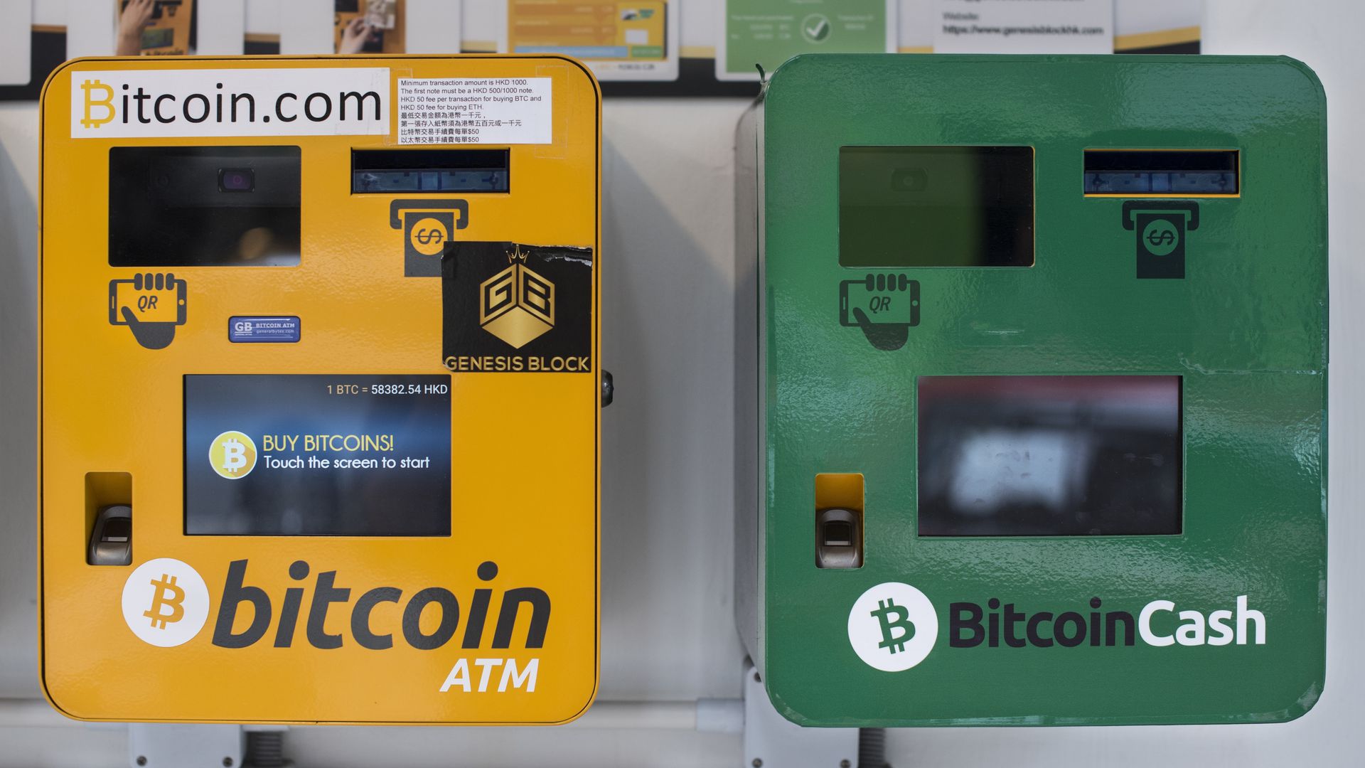 Two Bitcoin ATM machines, one yellow, one green, in Hong Kong