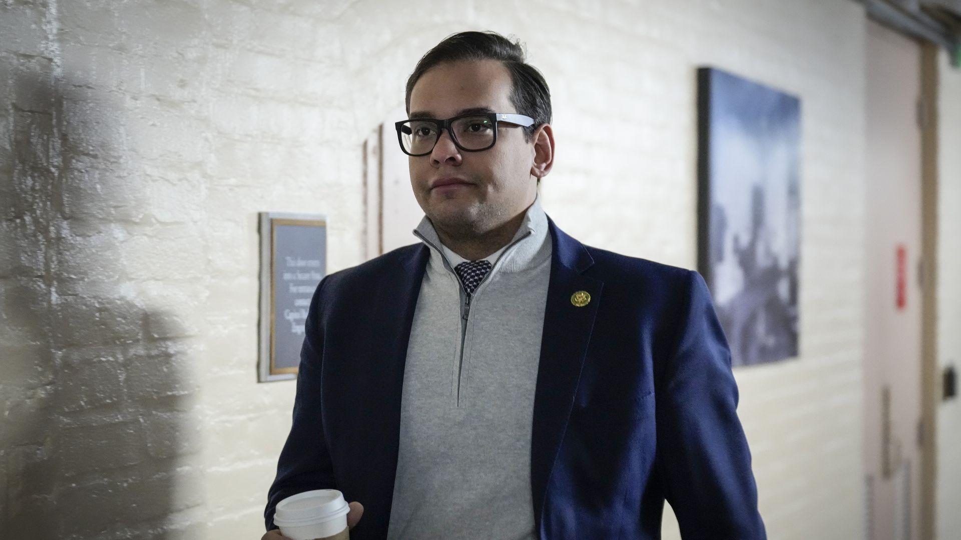 Rep. George Santos (R-NY) walks to a closed-door GOP caucus meeting at the U.S. Capitol January 10, 2023