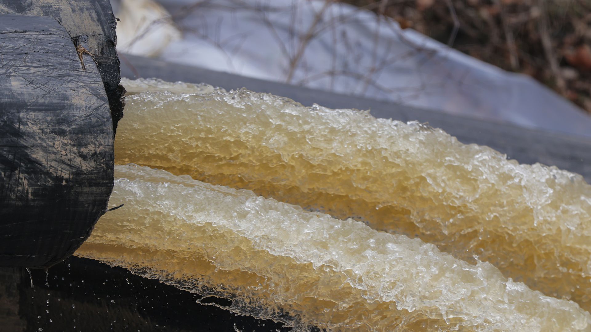 A picture of sewage flowing out of pipes that were being used to divert wastewater away from the Potomac River