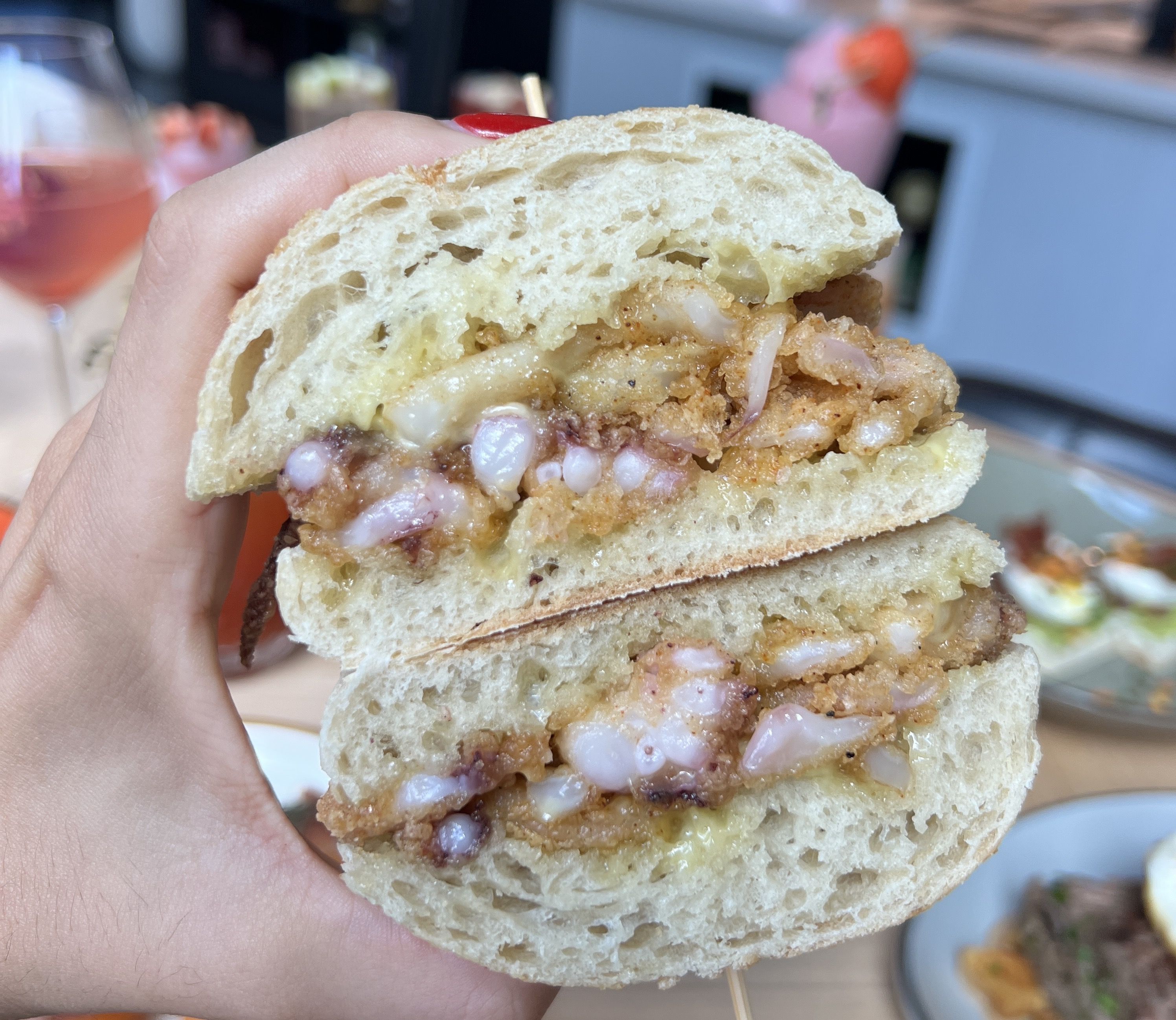 hand holding sandwich