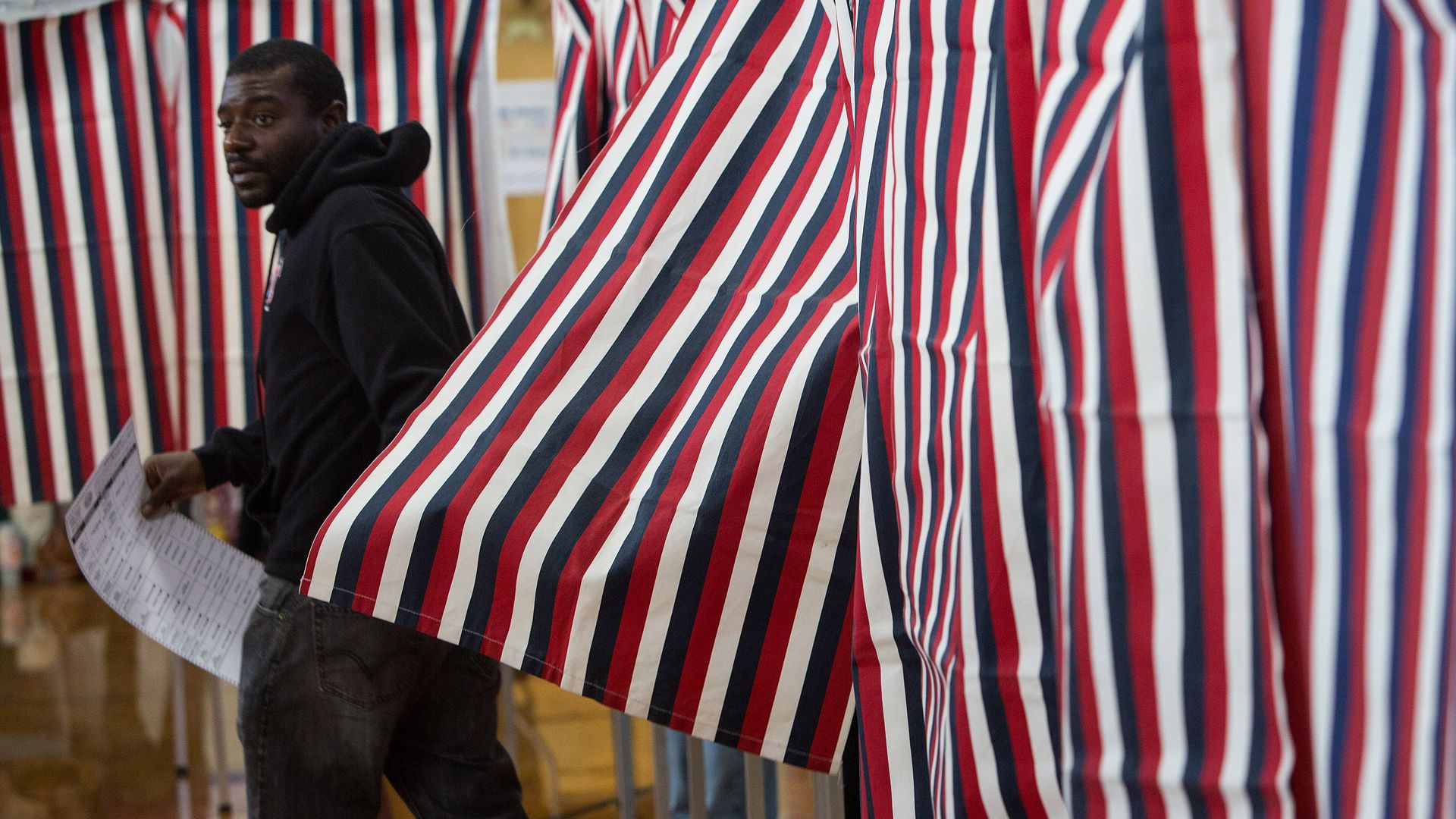 A New Hampshire voter casts his ballot at Amherst Street Elementary School. 