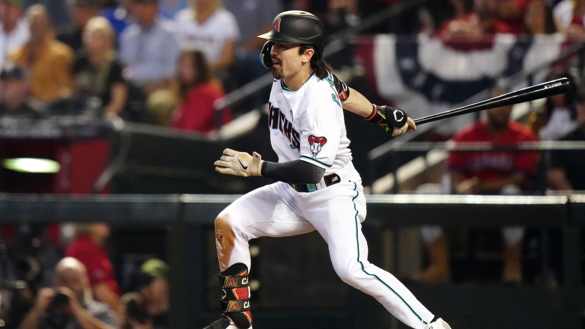 A baseball player hitting.